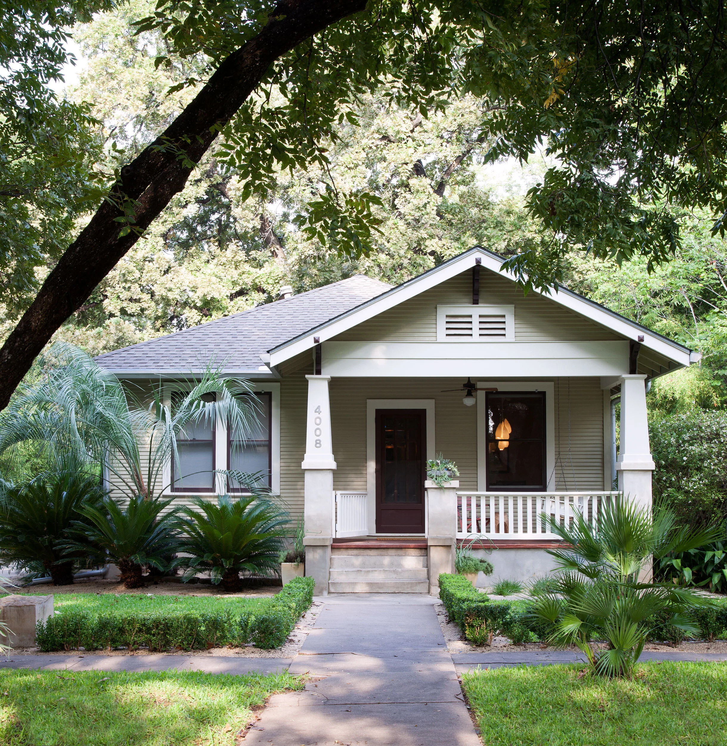  Exterior of the historic Avenue H bungalow in Austin by Cravotta Interiors. 