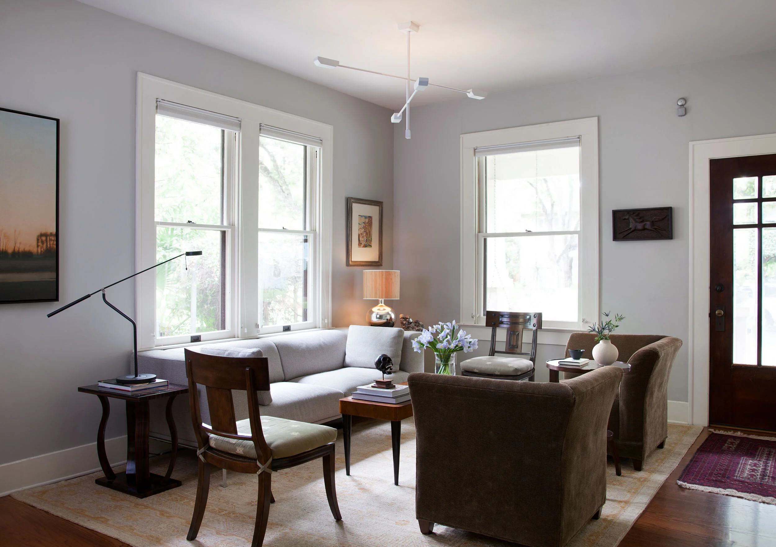  Art-filled living room with eclectic modern and antique pieces at Avenue H, designed by Mark Cravotta. 