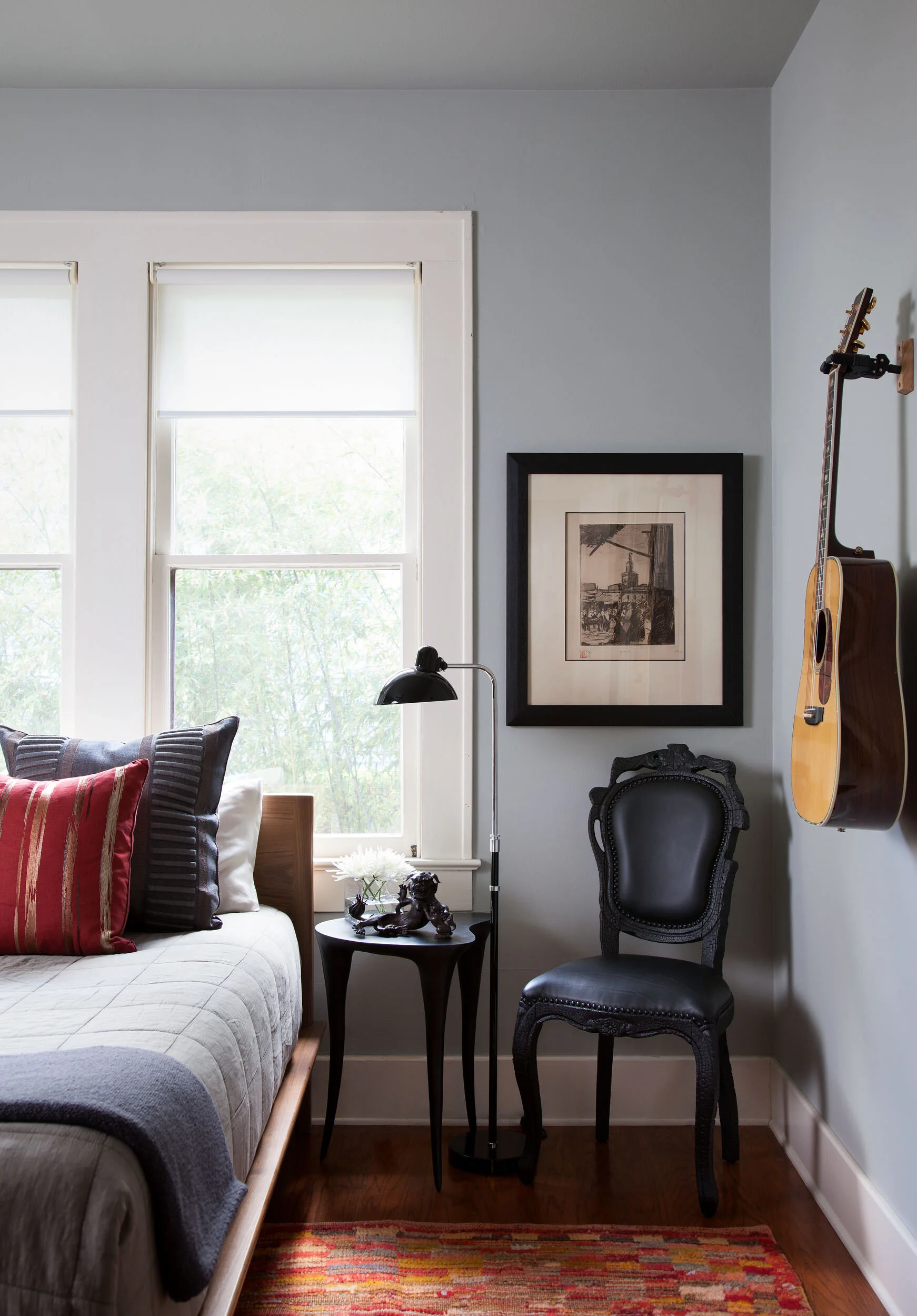  Colorful, art-filled bedroom in the Avenue H bungalow, designed by Mark Cravotta. 