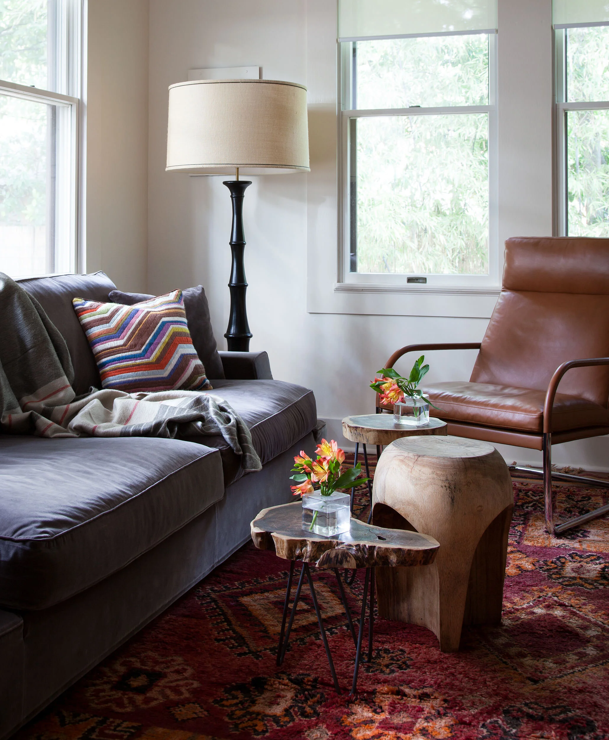  Colorful den and TV room with eclectic art collection at the Avenue H bungalow by Cravotta Interiors. 
