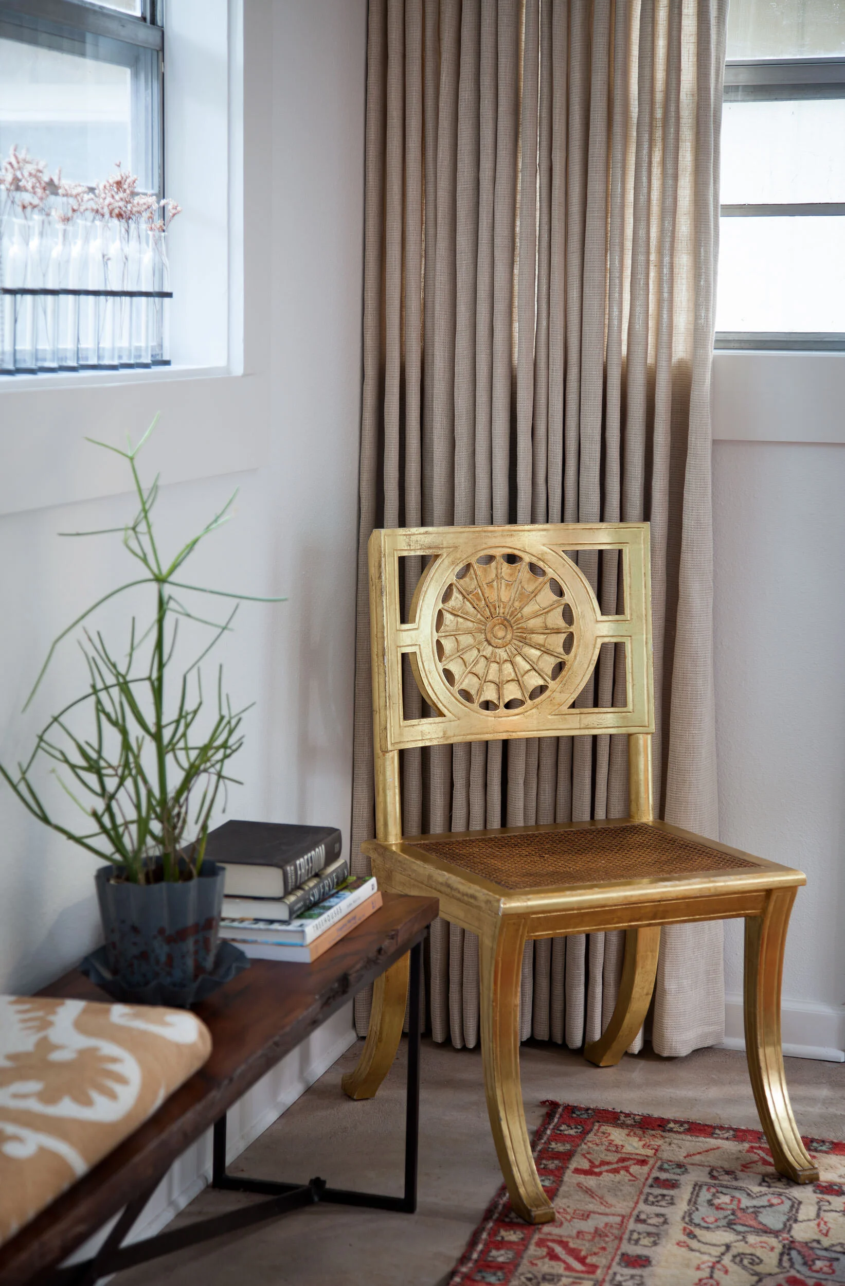  Gold Egyptian chair and art vignette in the Avenue H casita bedroom, designed by Mark Cravotta. 