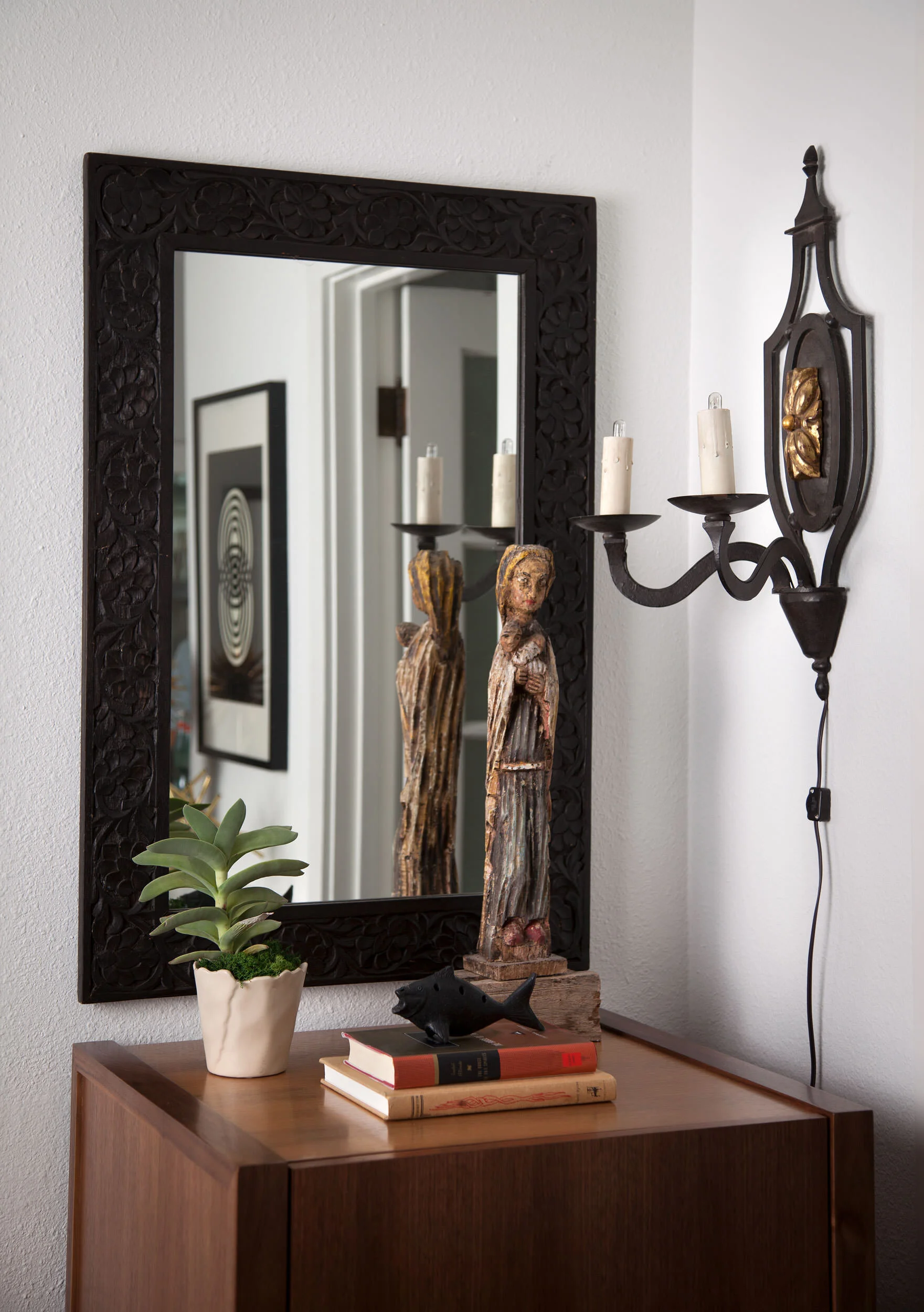  Vignette in the Avenue H casita living room with modern and antique pieces by Cravotta Interiors. 