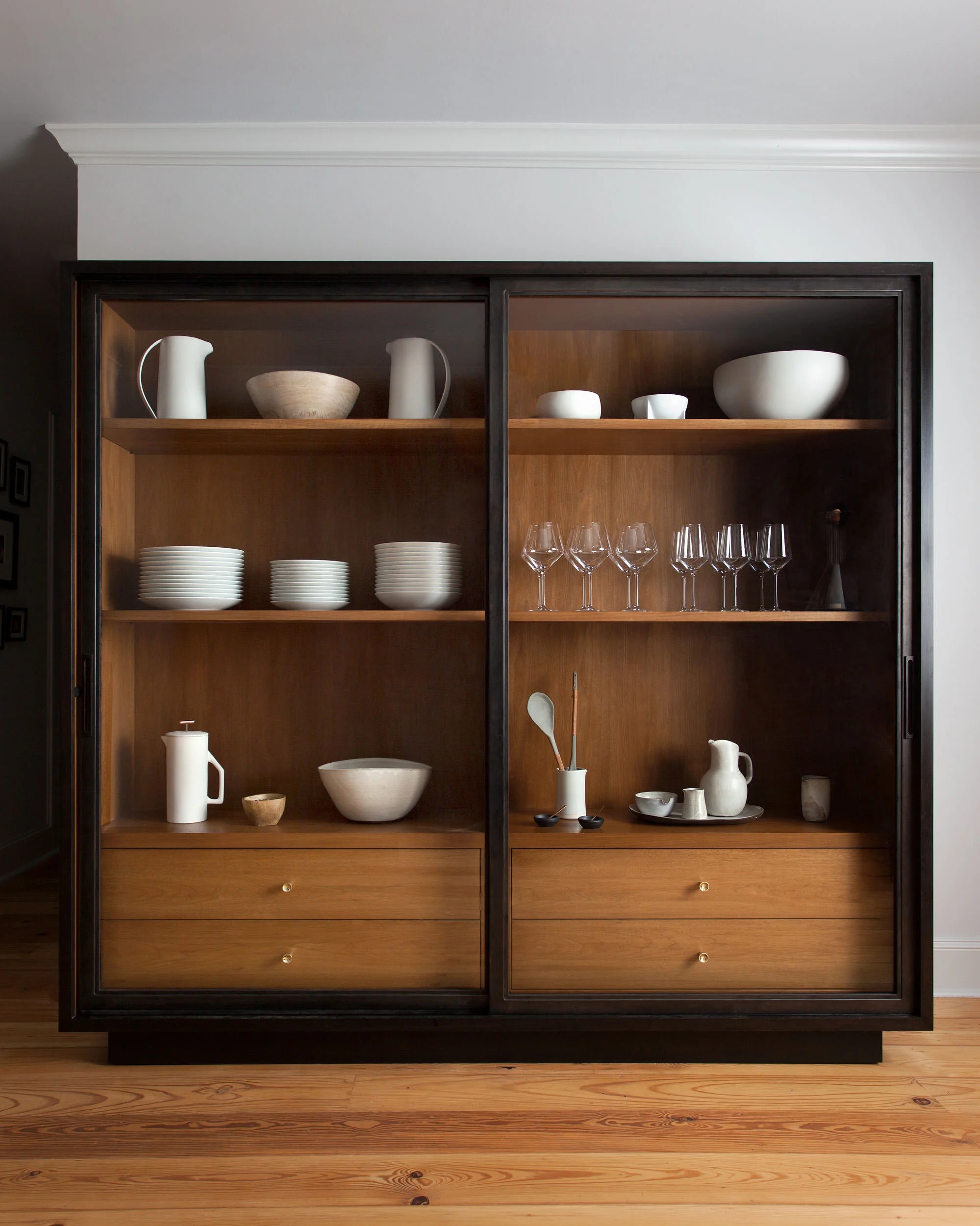  Custom steel and walnut cabinet in the Hyde Park Bungalow dining room, designed by Mark Cravotta. 