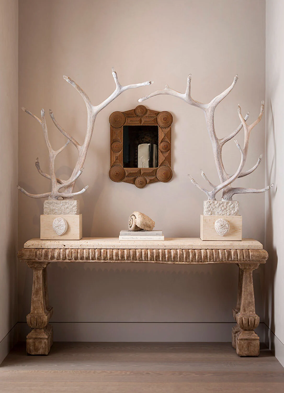  Romantic vignette with antler sculptures in the Rocky River Austin residence by Cravotta Interiors. 