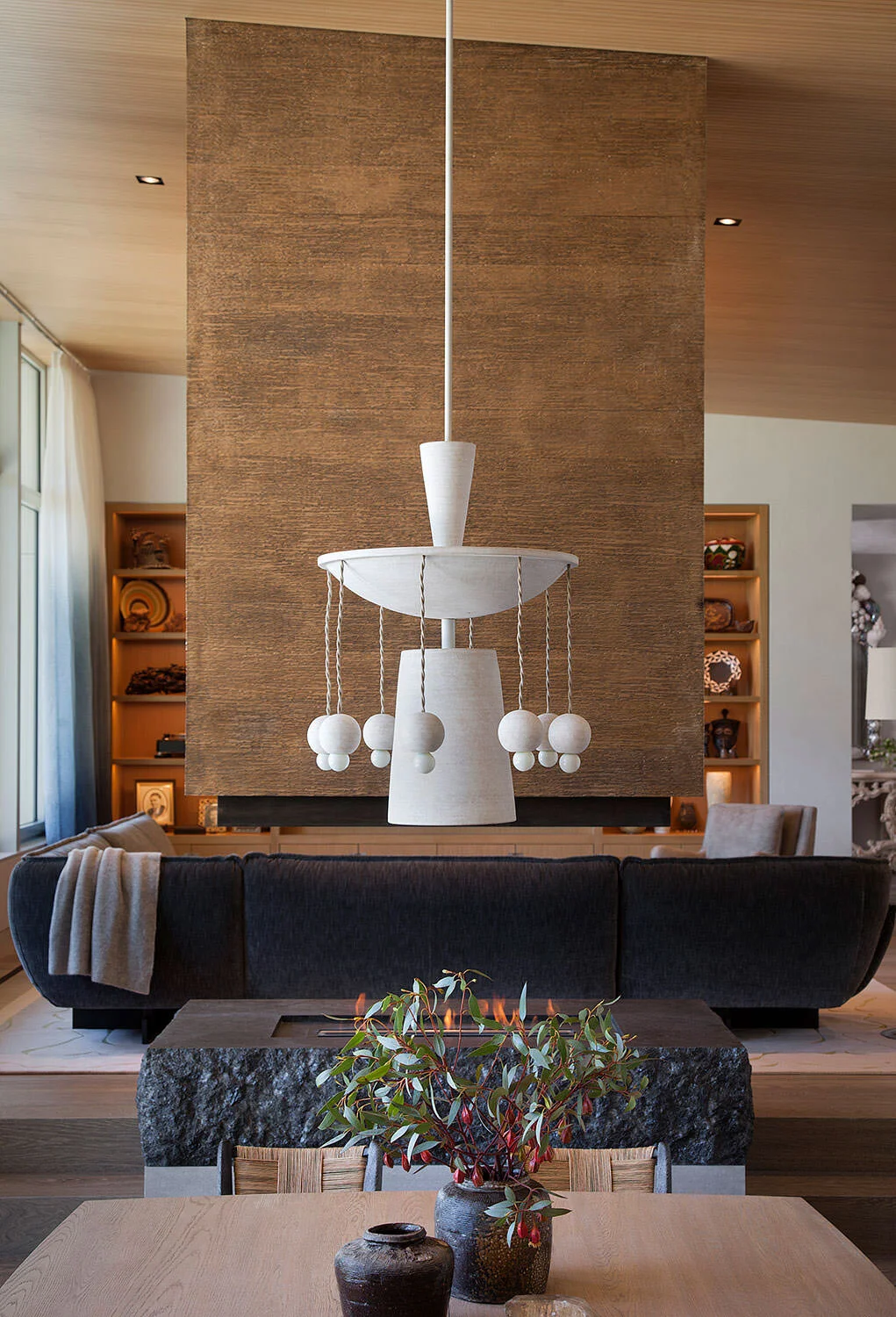  Wider view of the Rocky River dining room showing the bronze screen and fireplace together, designed by Mark Cravotta. 
