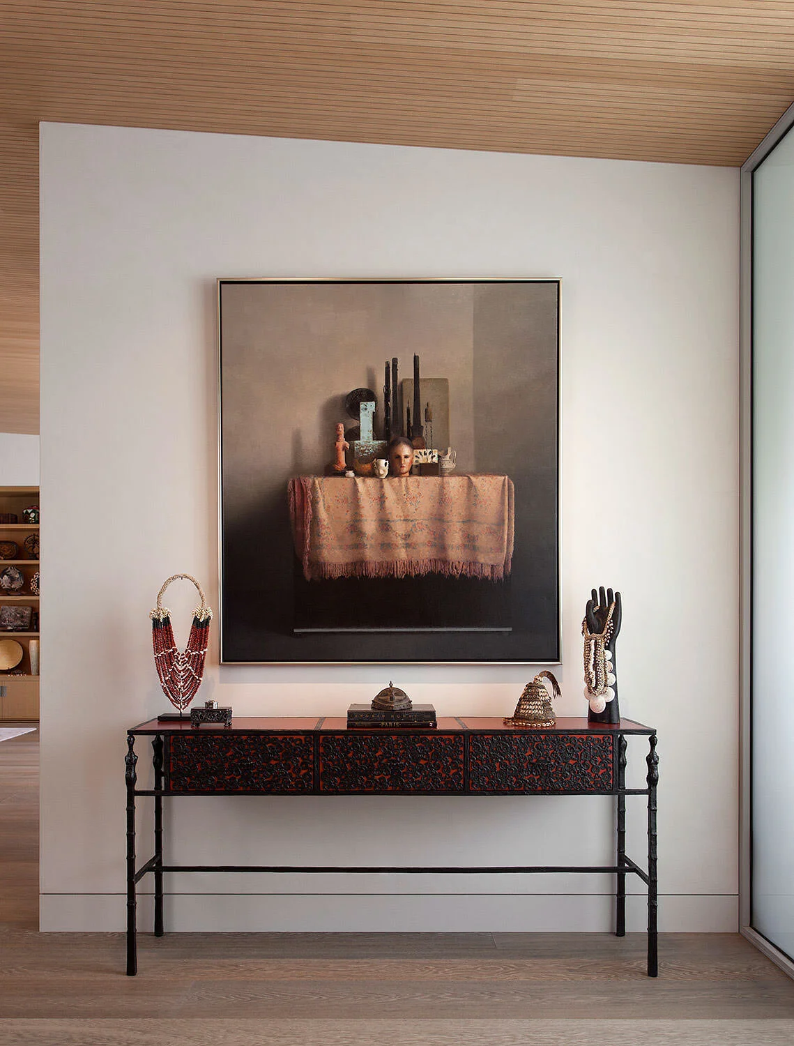  Custom Ingrid Donat bronze and leather console beneath the wood ceiling at Rocky River by Cravotta Interiors. 