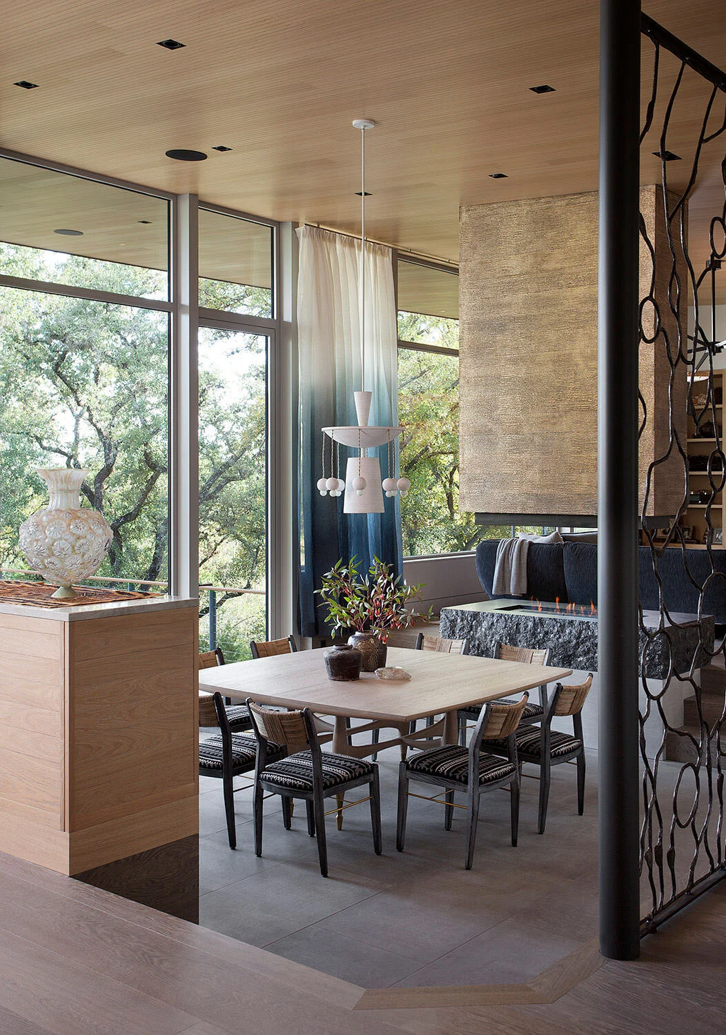  Dining room with custom bronze screen and hand-painted drapes in the Rocky River Austin home by Cravotta Interiors. 