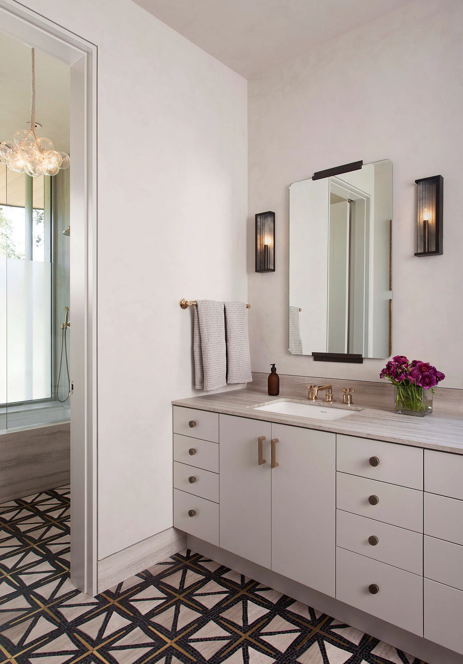  Guest bathroom with plaster walls and custom mosaic tile floor at Rocky River, designed by Mark Cravotta. 