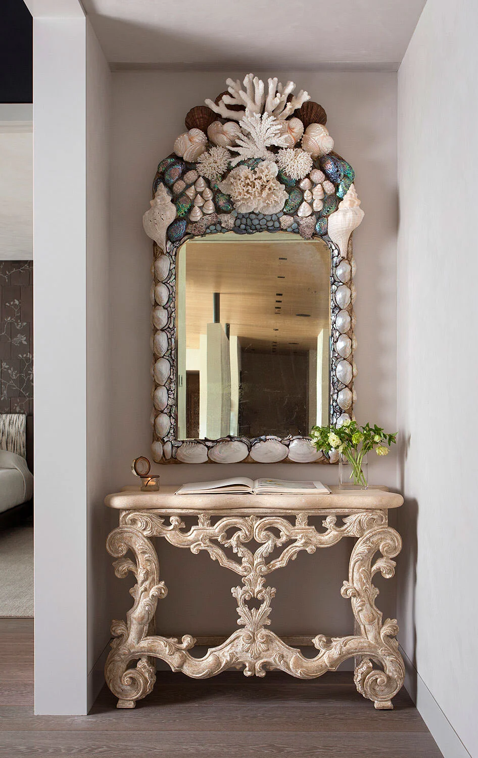  Hallway vignette with custom console and shell mirror at Rocky River by Cravotta Interiors. 