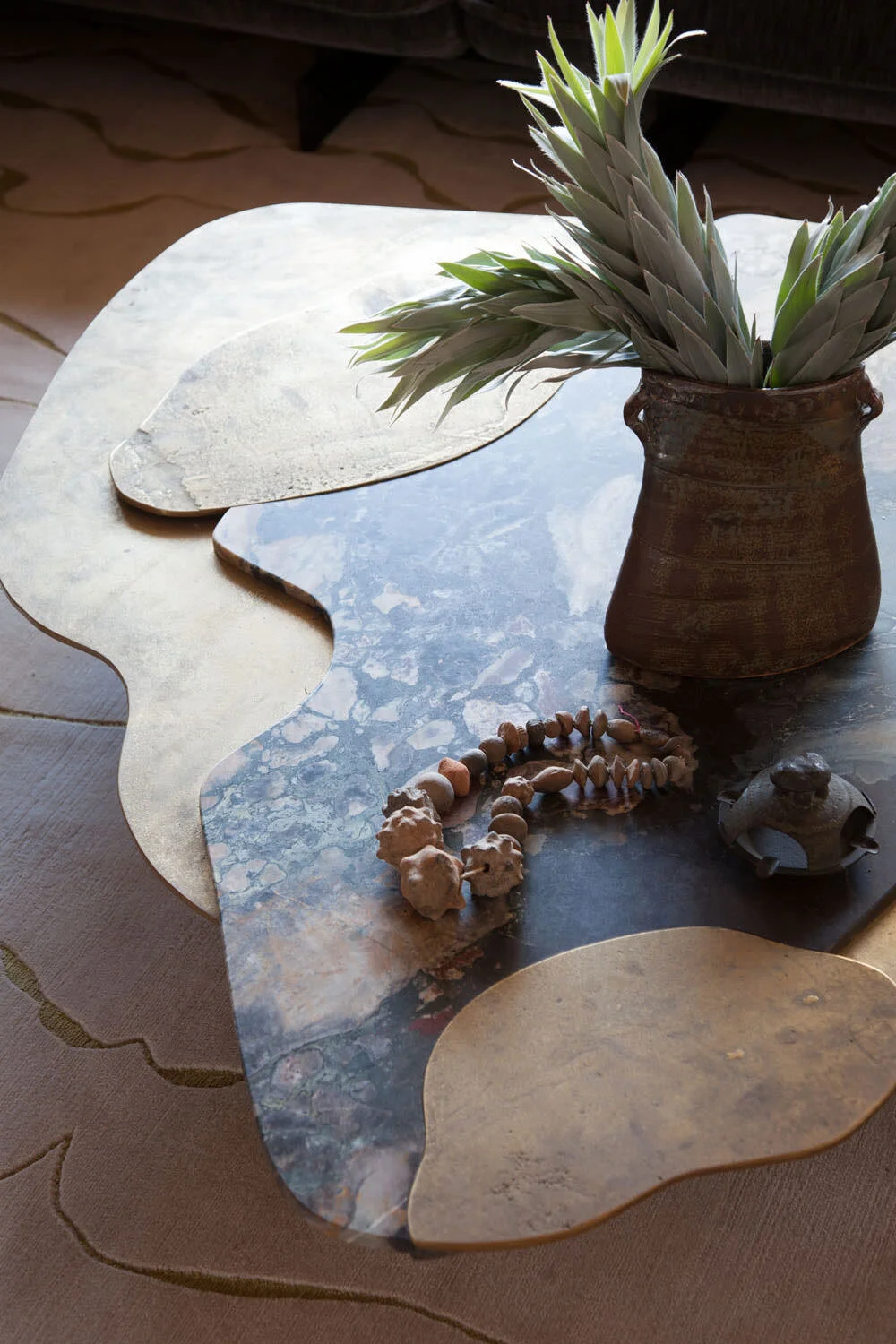  Detail of the Vincenzo De Cotiis bronze and marble coffee table at Rocky River, designed by Mark Cravotta. 