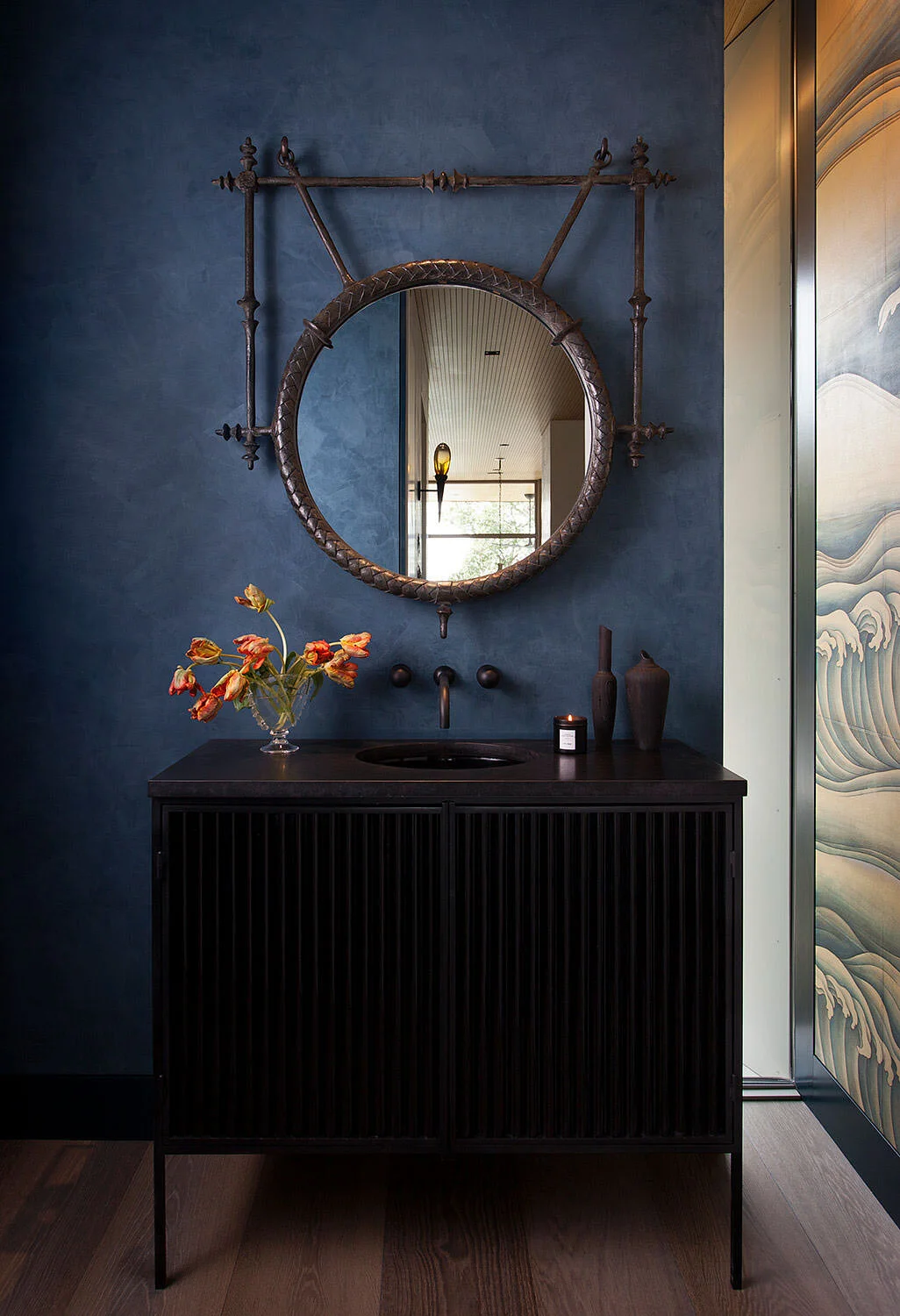  Moody powder room with custom vanity and blue plaster walls at Rocky River, designed by Mark Cravotta. 