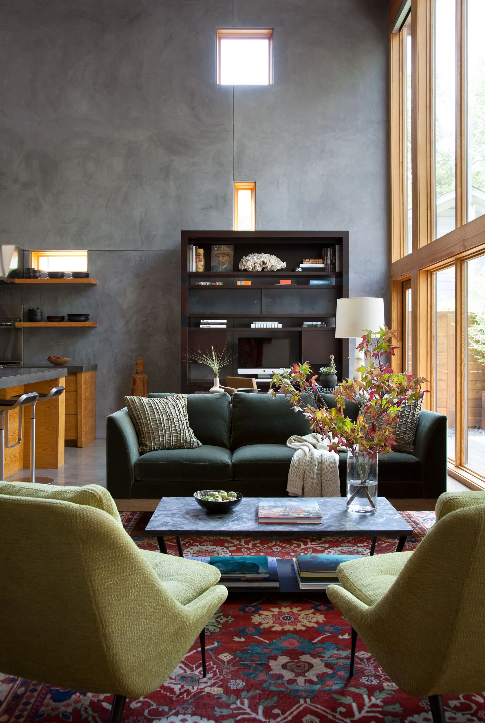  View toward built-in bookshelf with plaster walls and cypress millwork at Zilker Contemporary, designed by Mark Cravotta. 