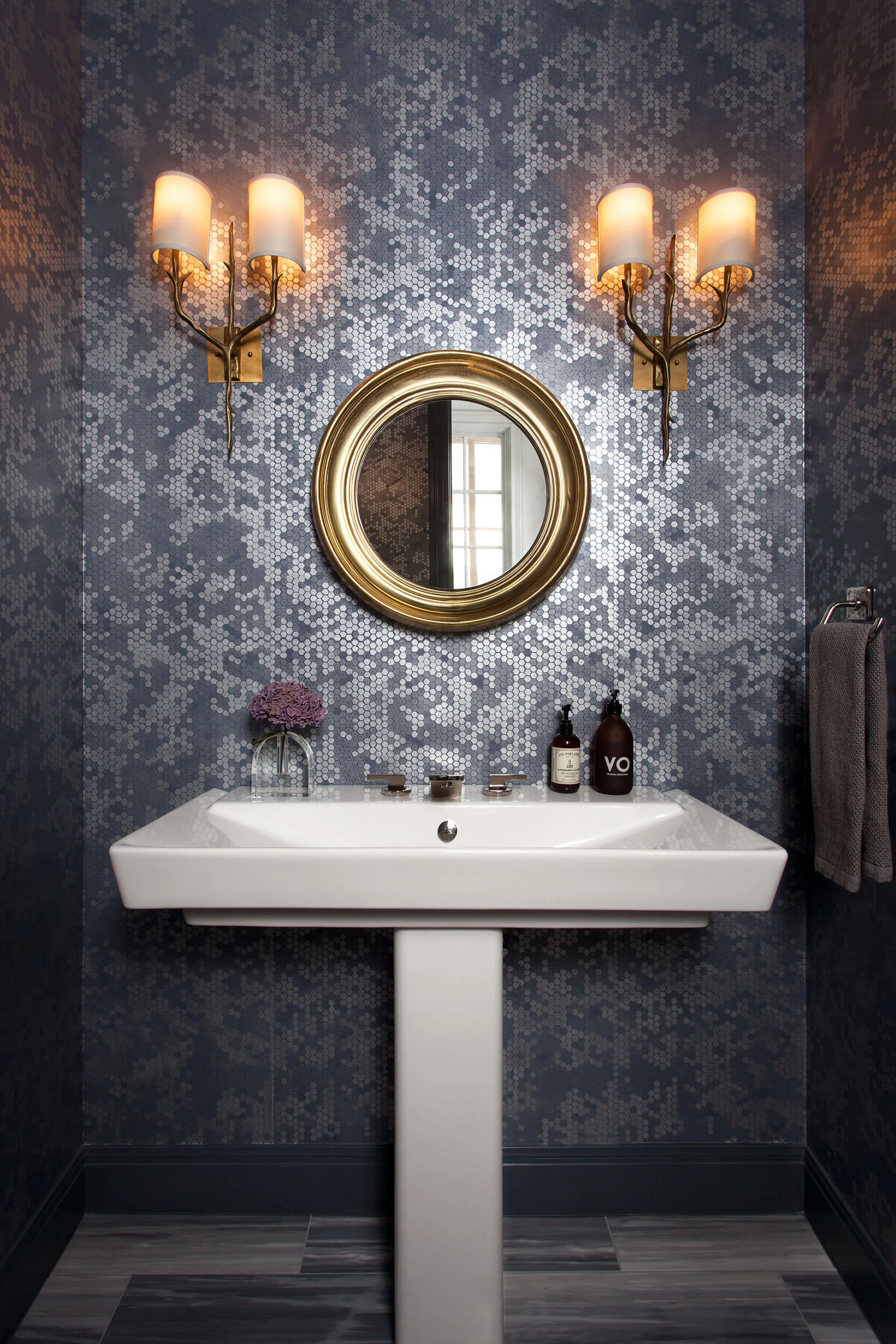 Powder room with handmade plaster wallpaper and antique French sconces at Northumberland, designed by Mark Cravotta. 