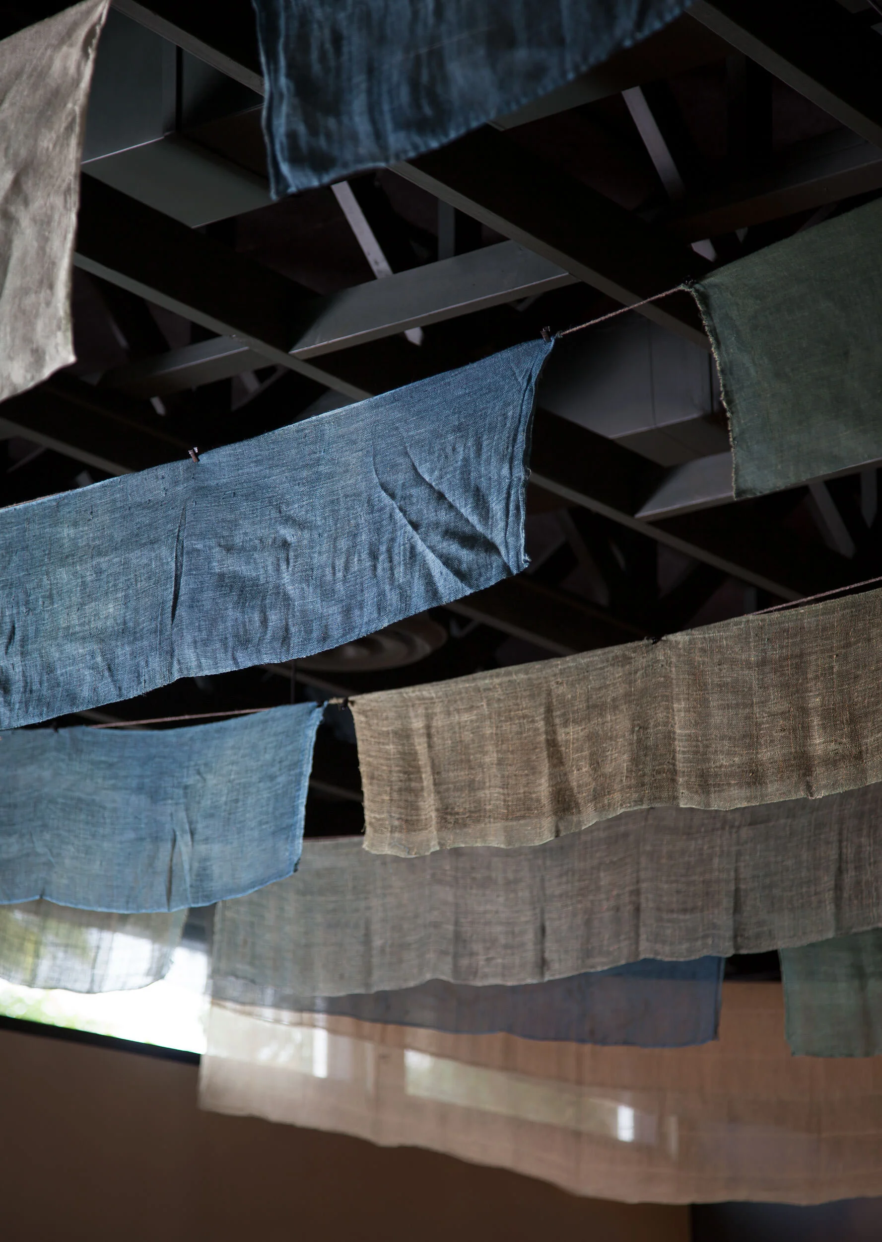  Antique linen scrim hung from the dining room ceiling at Oseyo Korean Restaurant by Cravotta Interiors. 