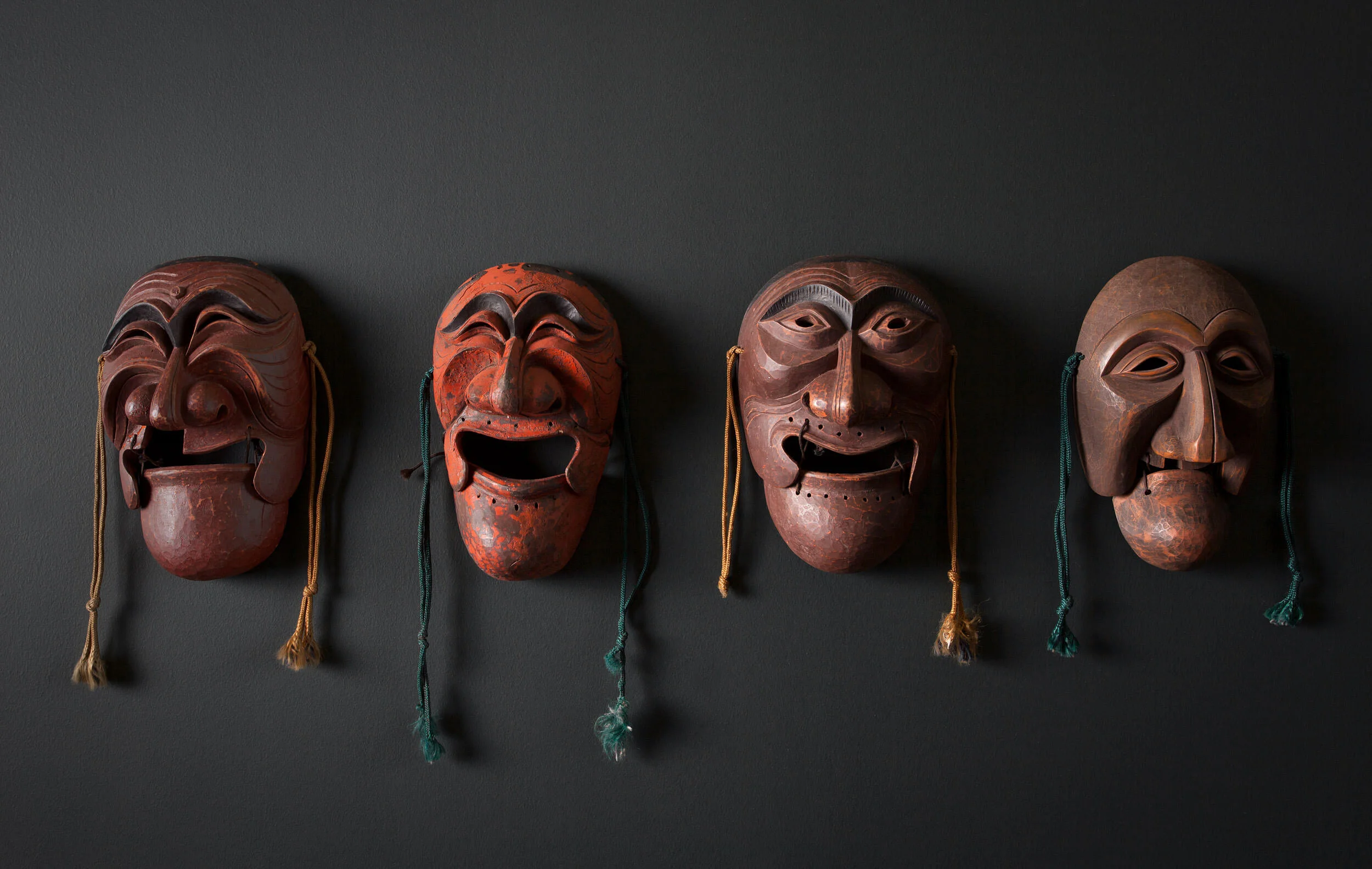  Art wall of antique Korean Hahoe masks at Oseyo Korean Restaurant by Cravotta Interiors. 