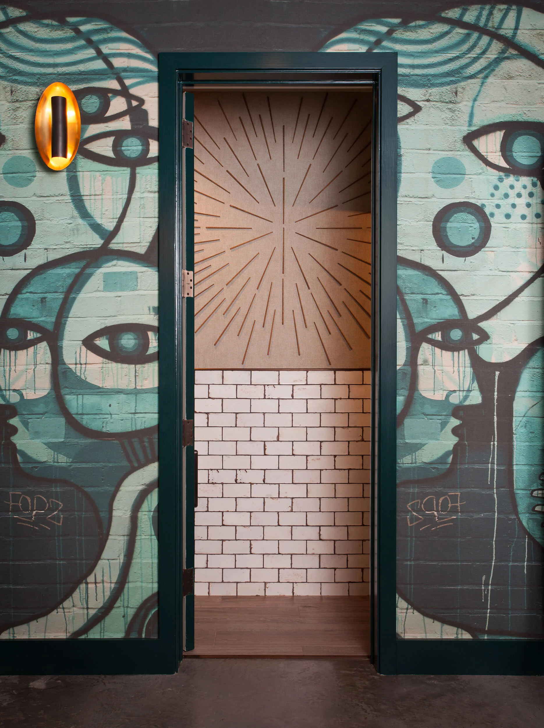  Restroom vestibule with custom wallpaper at Oseyo, designed by Mark Cravotta. 