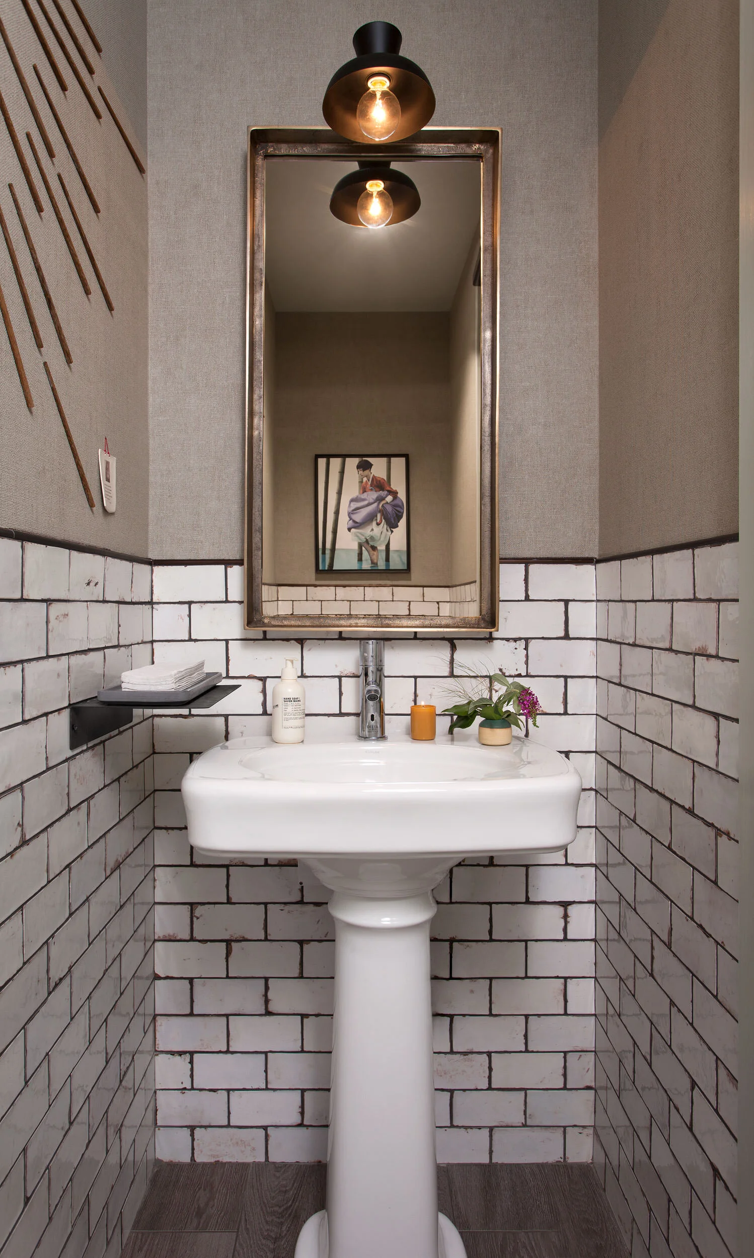  Restroom with wall sculpture made from chopsticks at Oseyo Korean Restaurant by Cravotta Interiors. 