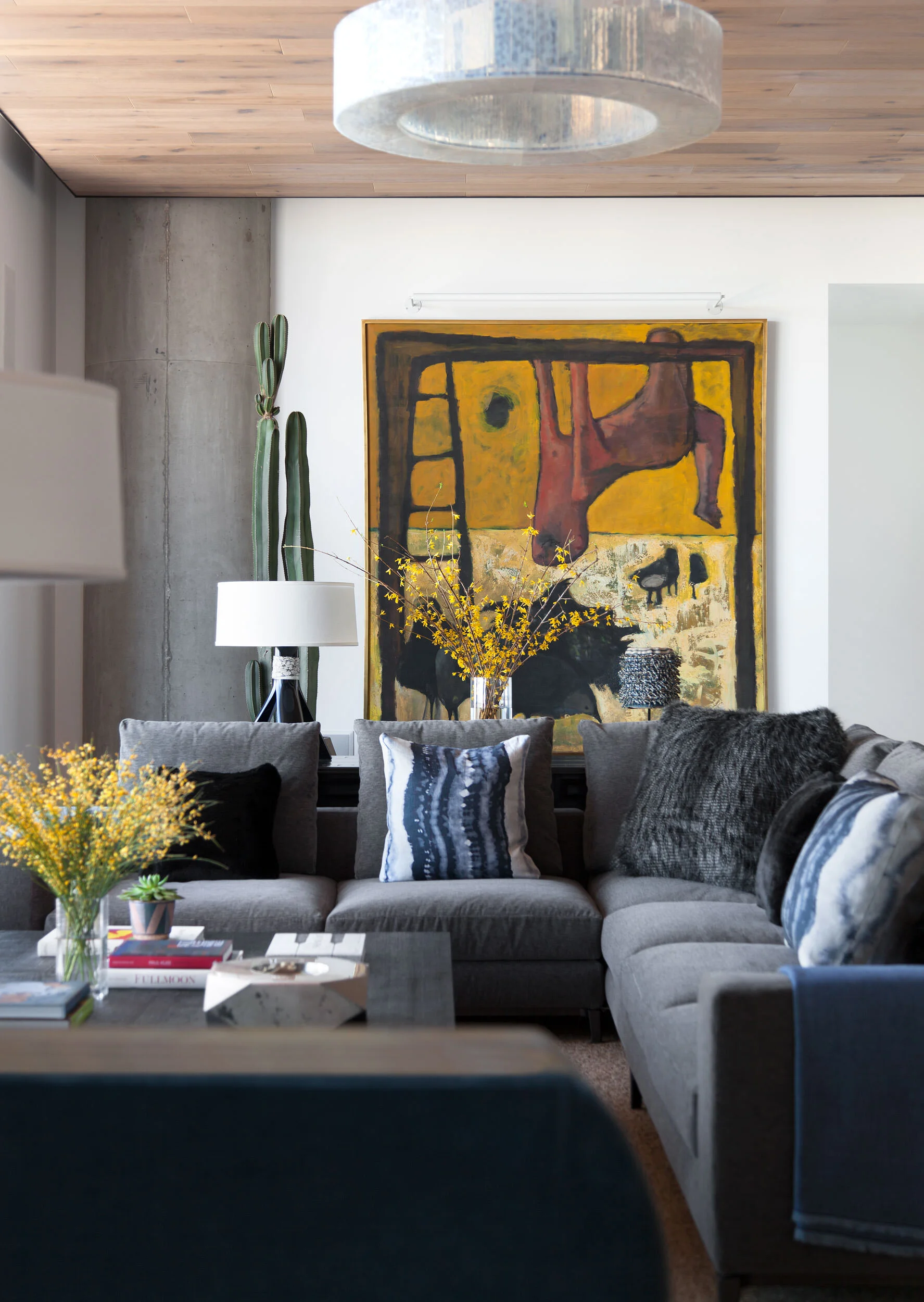  Wood ceiling living room with handmade McEwan glass chandelier, vintage art, and Minotti sectional in the W Penthouse, designed by Mark Cravotta. 