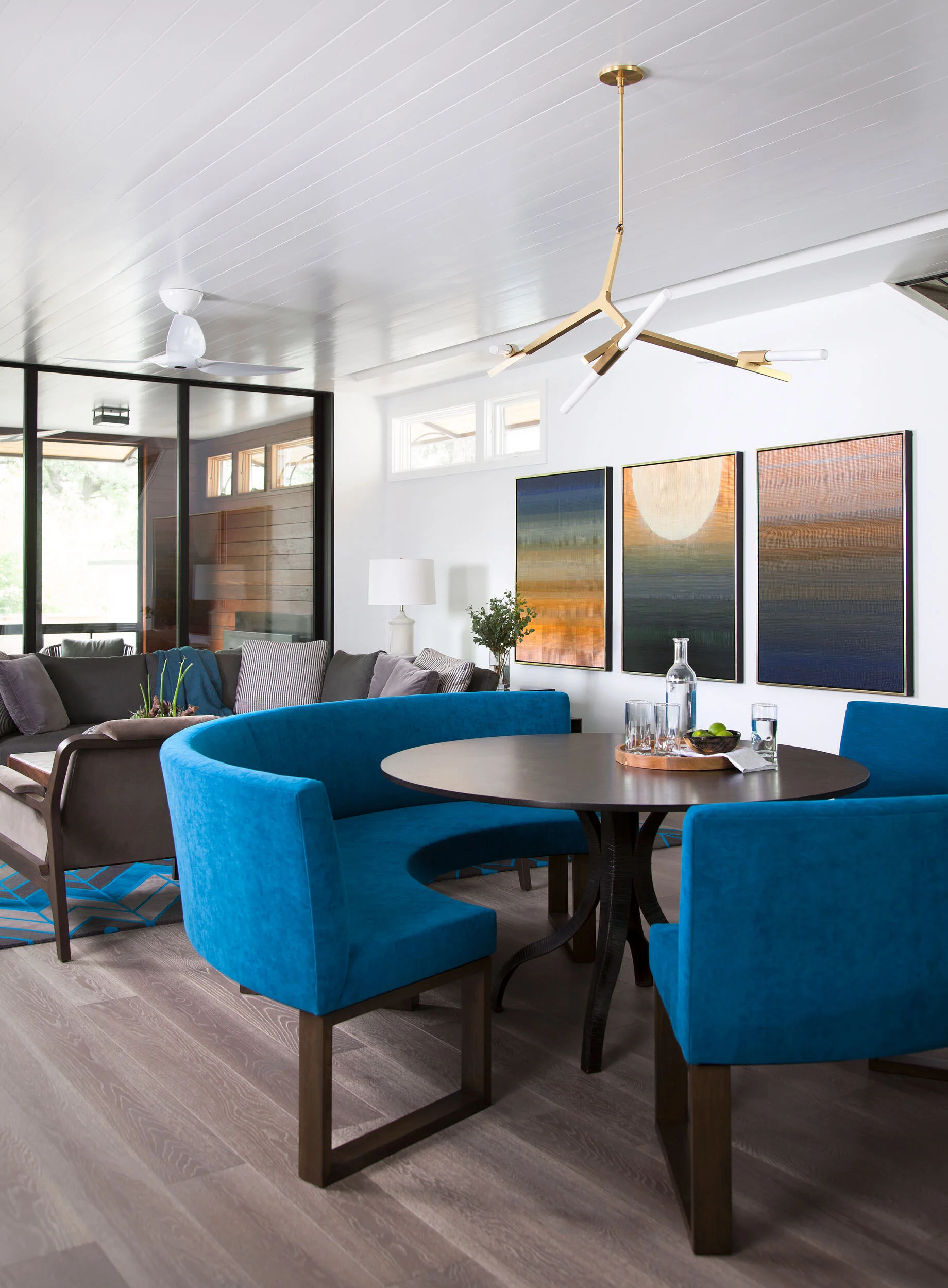  Dining room with wood ceiling and colorful furnishings in the Deep Eddy home by Cravotta Interiors. 