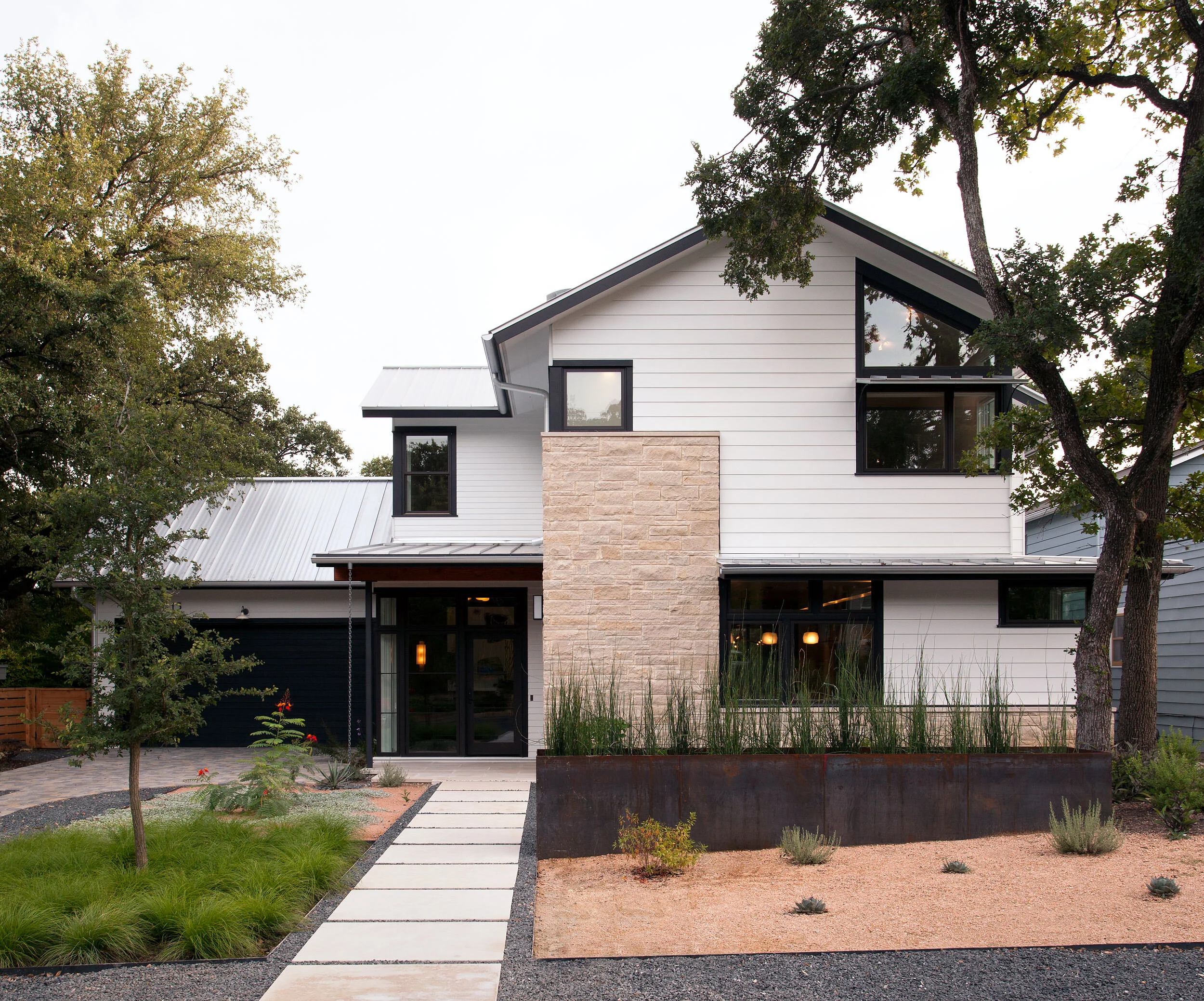  Exterior of the organic modern Deep Eddy home in Austin by Cravotta Interiors. 