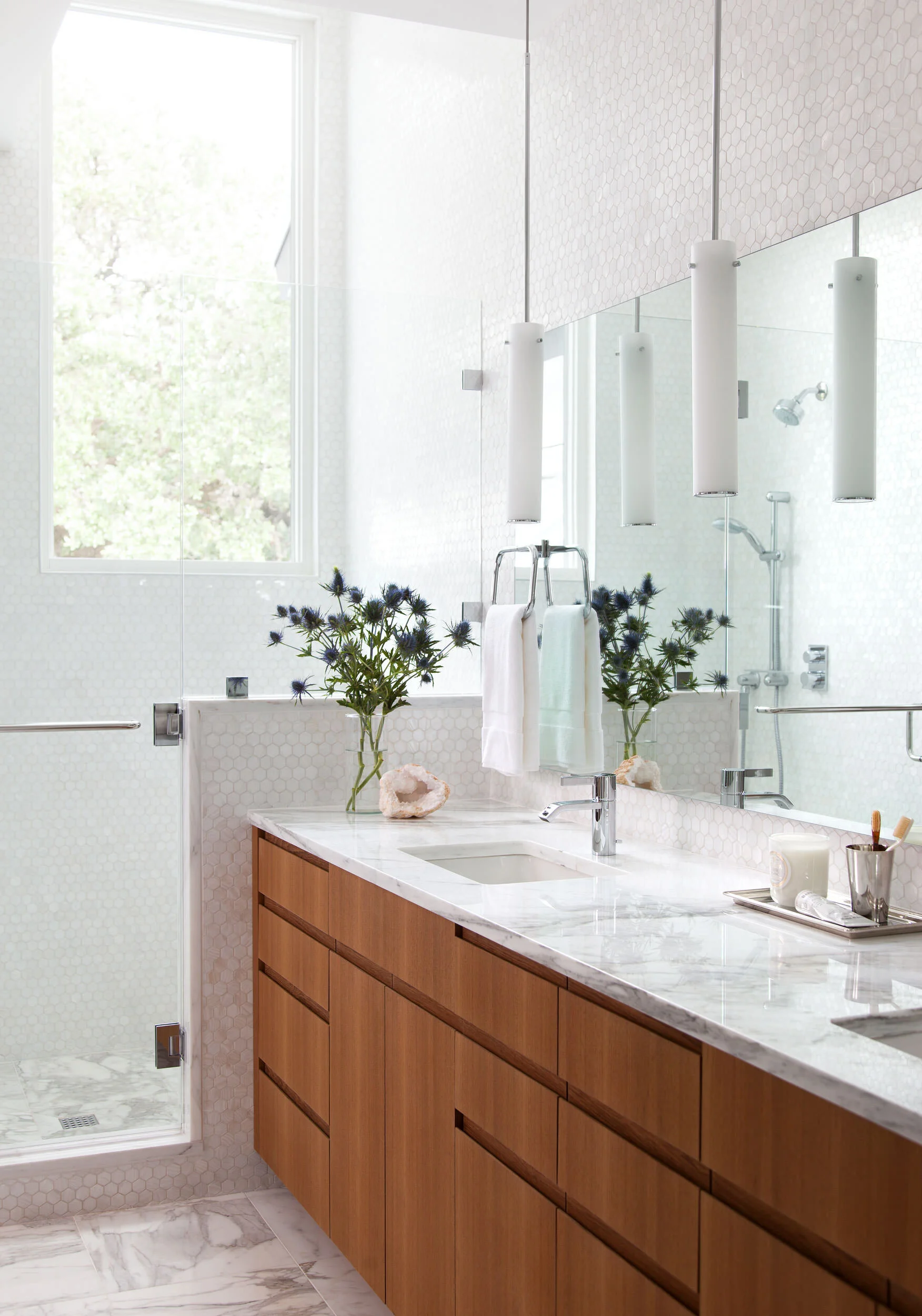  Light, bright bathroom with custom tile and vanity at the Deep Eddy home, designed by Mark Cravotta. 