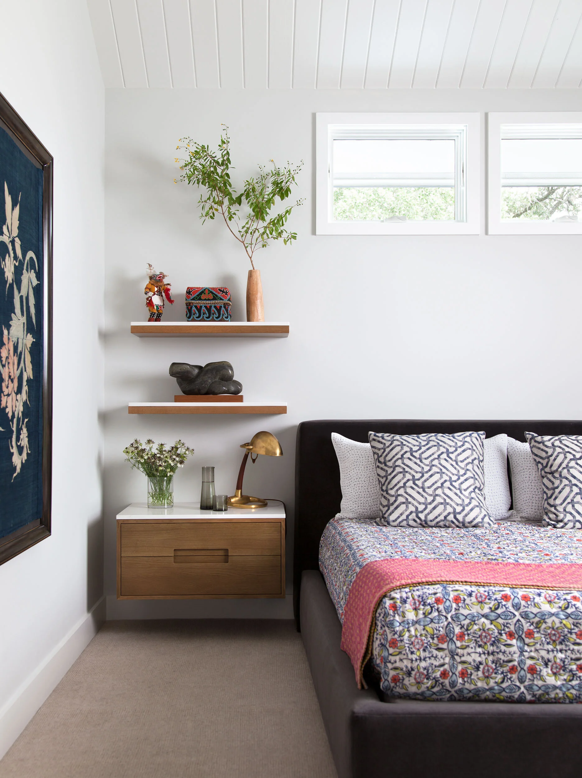  Bedroom with custom bed, nightstands, and wood ceiling at Deep Eddy by Cravotta Interiors. 
