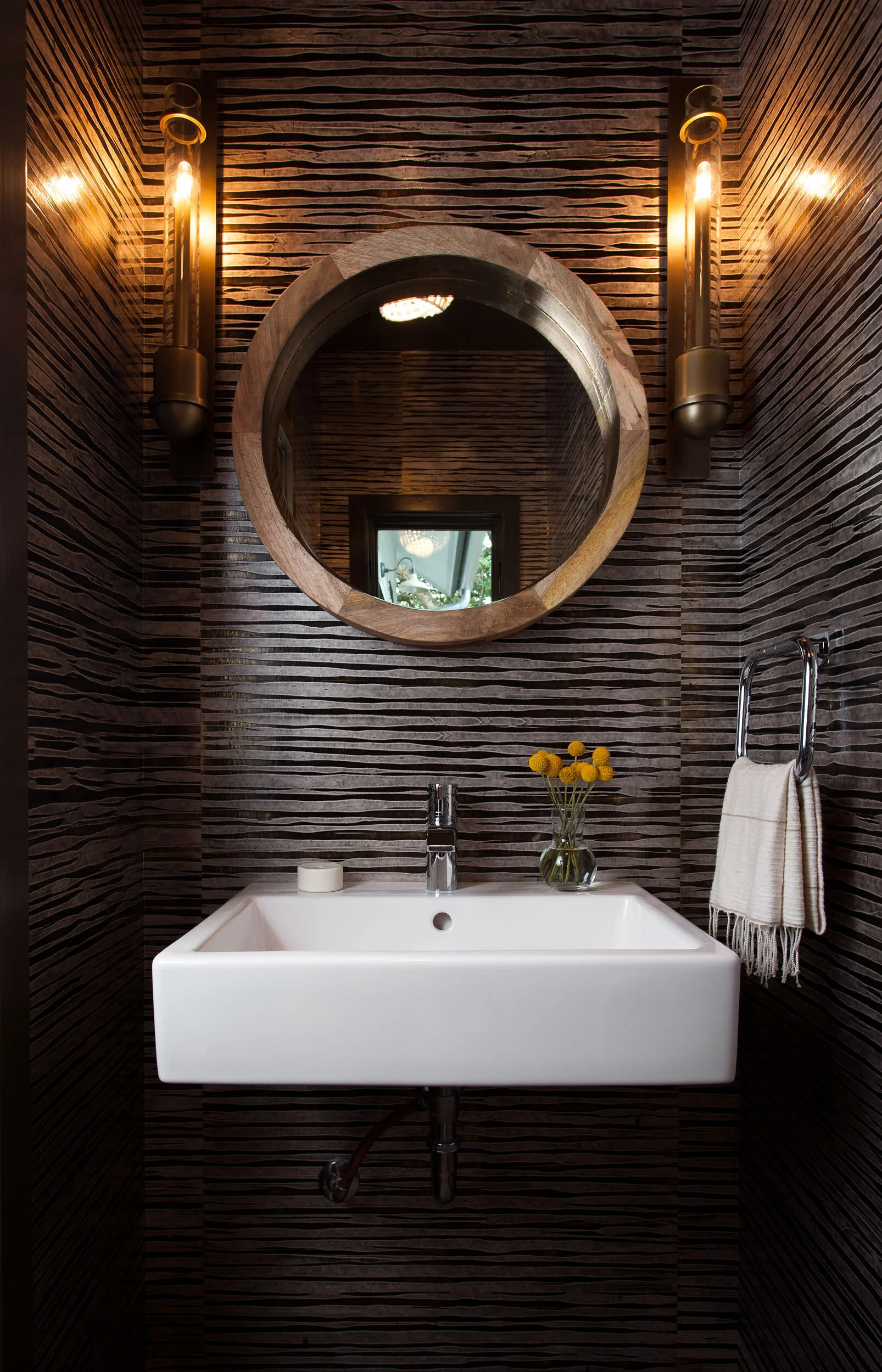  Moody powder room with plaster wallpaper at Deep Eddy by Cravotta Interiors. 
