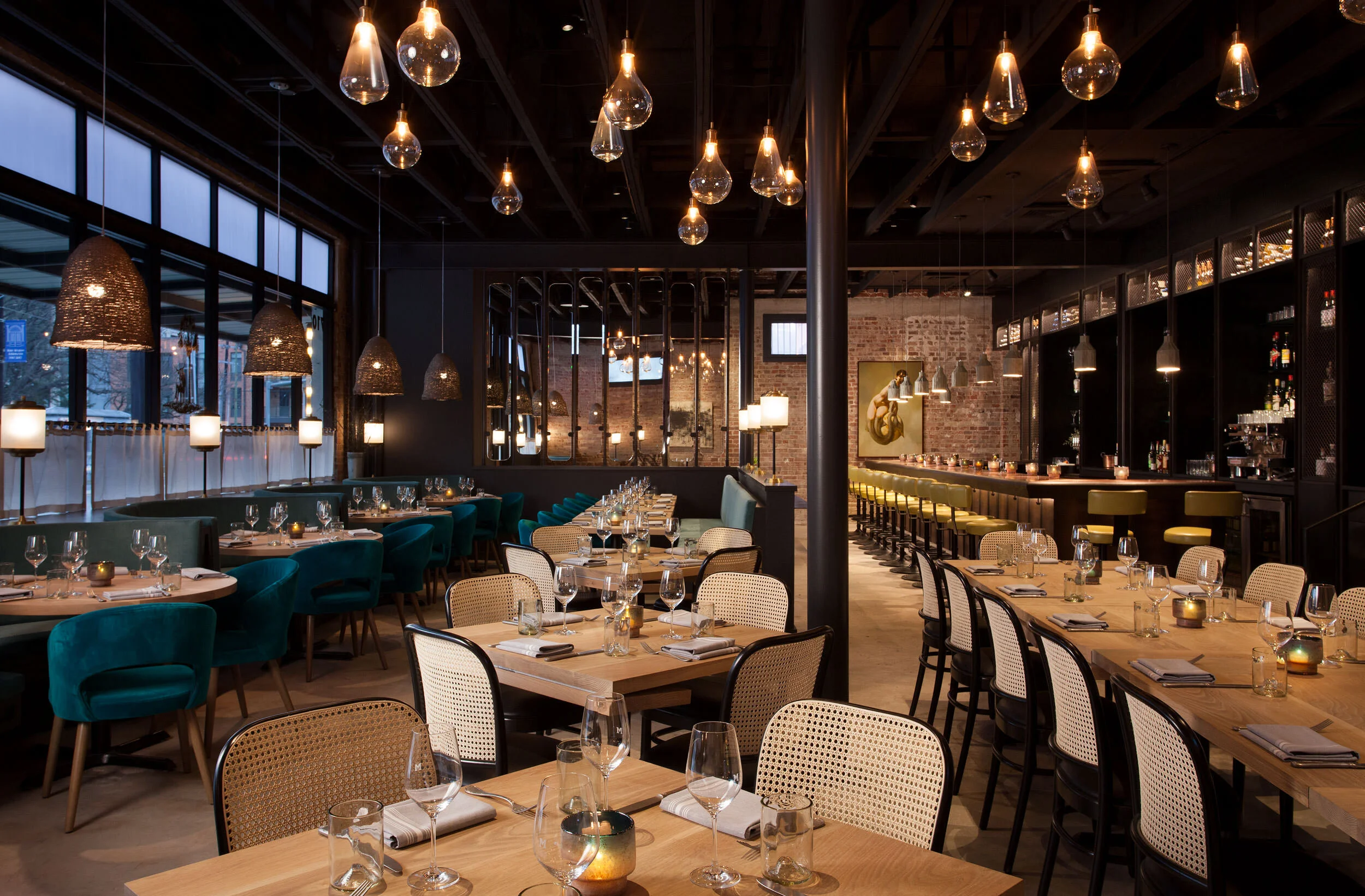  Full view of the Maverick main dining room with custom furniture and dramatic, textured finishes by Cravotta Interiors. 