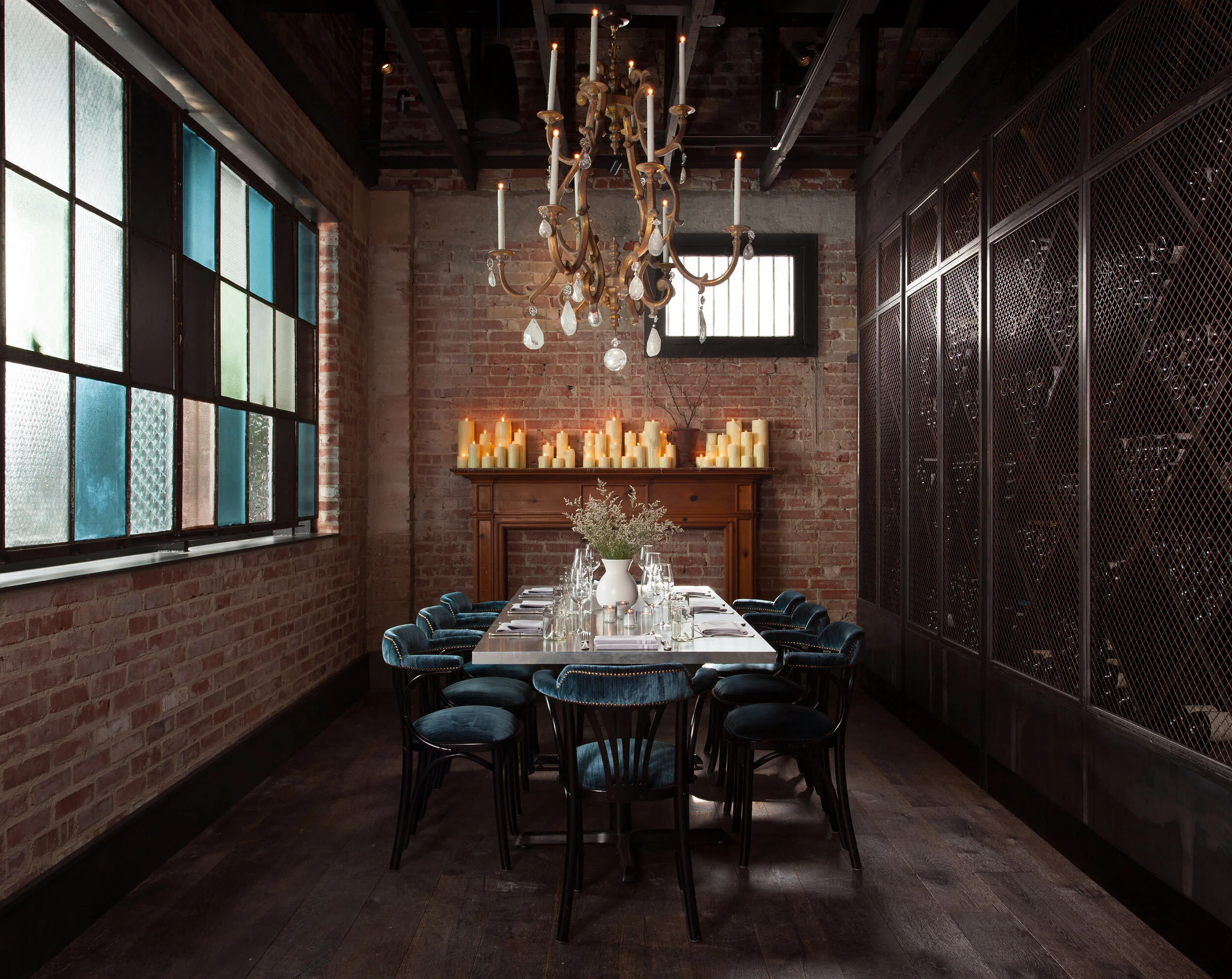  Private dining room with brick walls and custom furniture at the Maverick by Cravotta Interiors. 