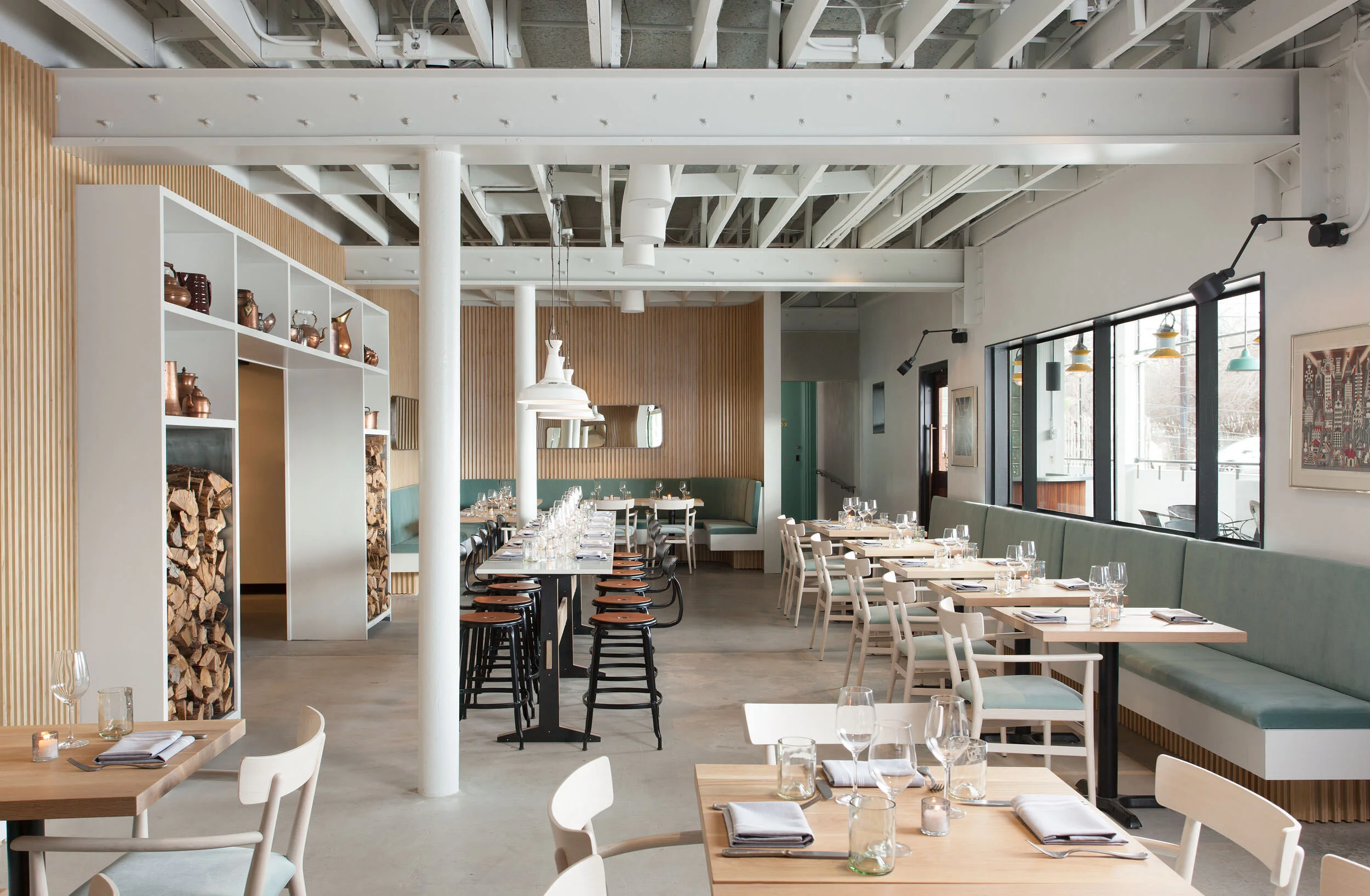  Light-filled garden dining room with custom furniture at the Maverick Restaurant, designed by Mark Cravotta. 