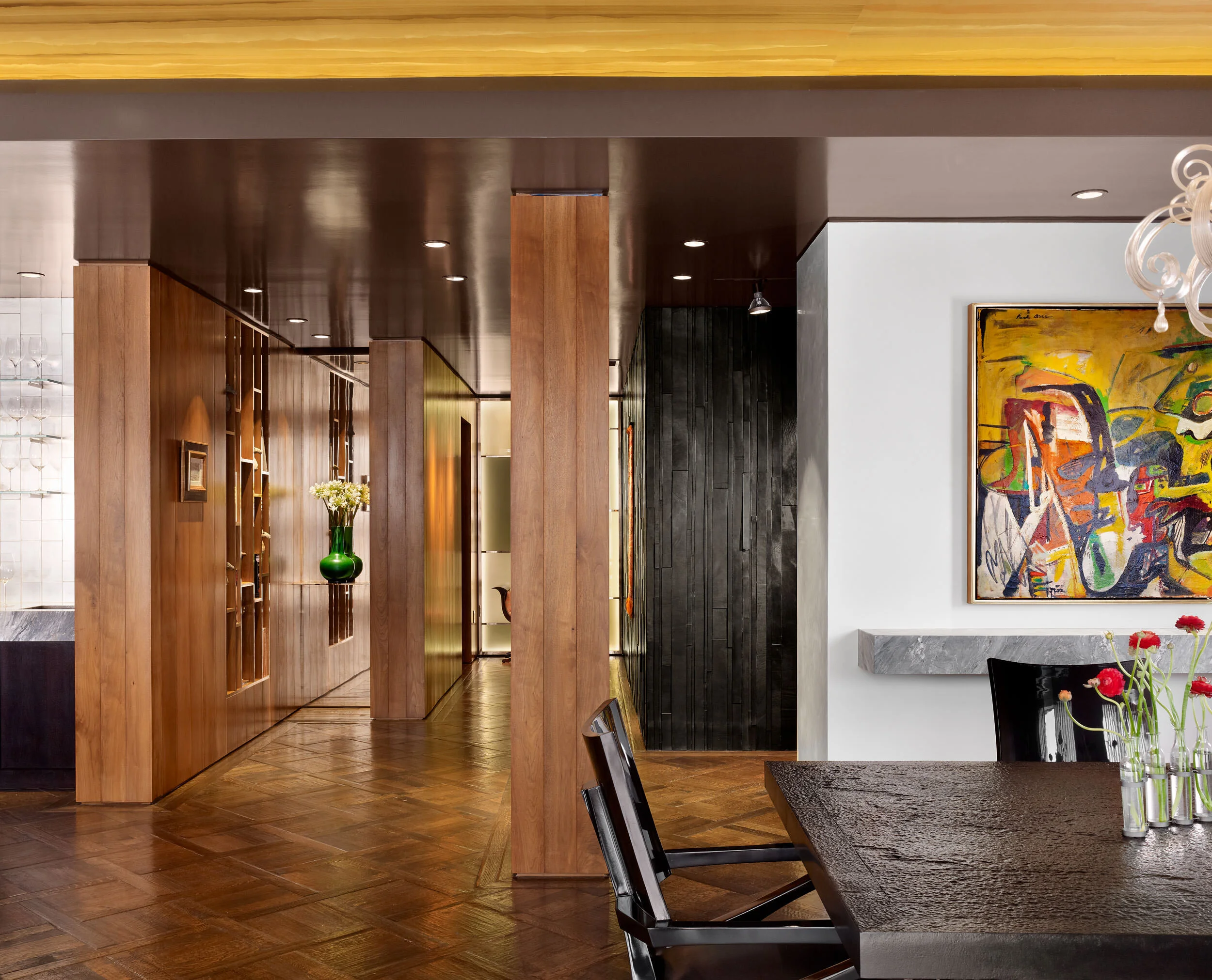  Dining hall with leather mosaic walls, custom table, and French walnut paneling at the Four Seasons Penthouse, designed by Mark Cravotta. 