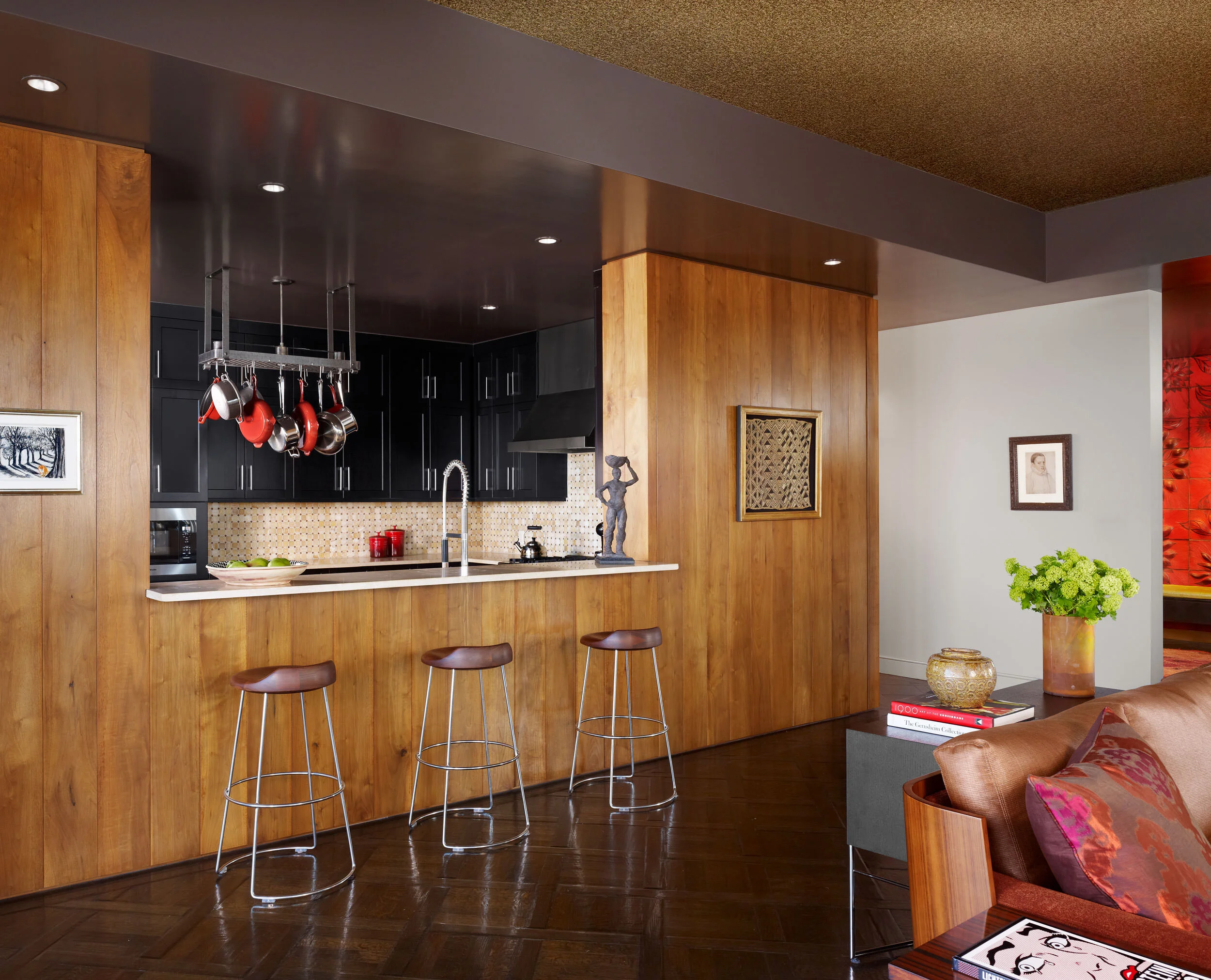  Kitchen with fire-red handmade sculptural tile and walnut paneling at the Four Seasons Penthouse, designed by Mark Cravotta. 