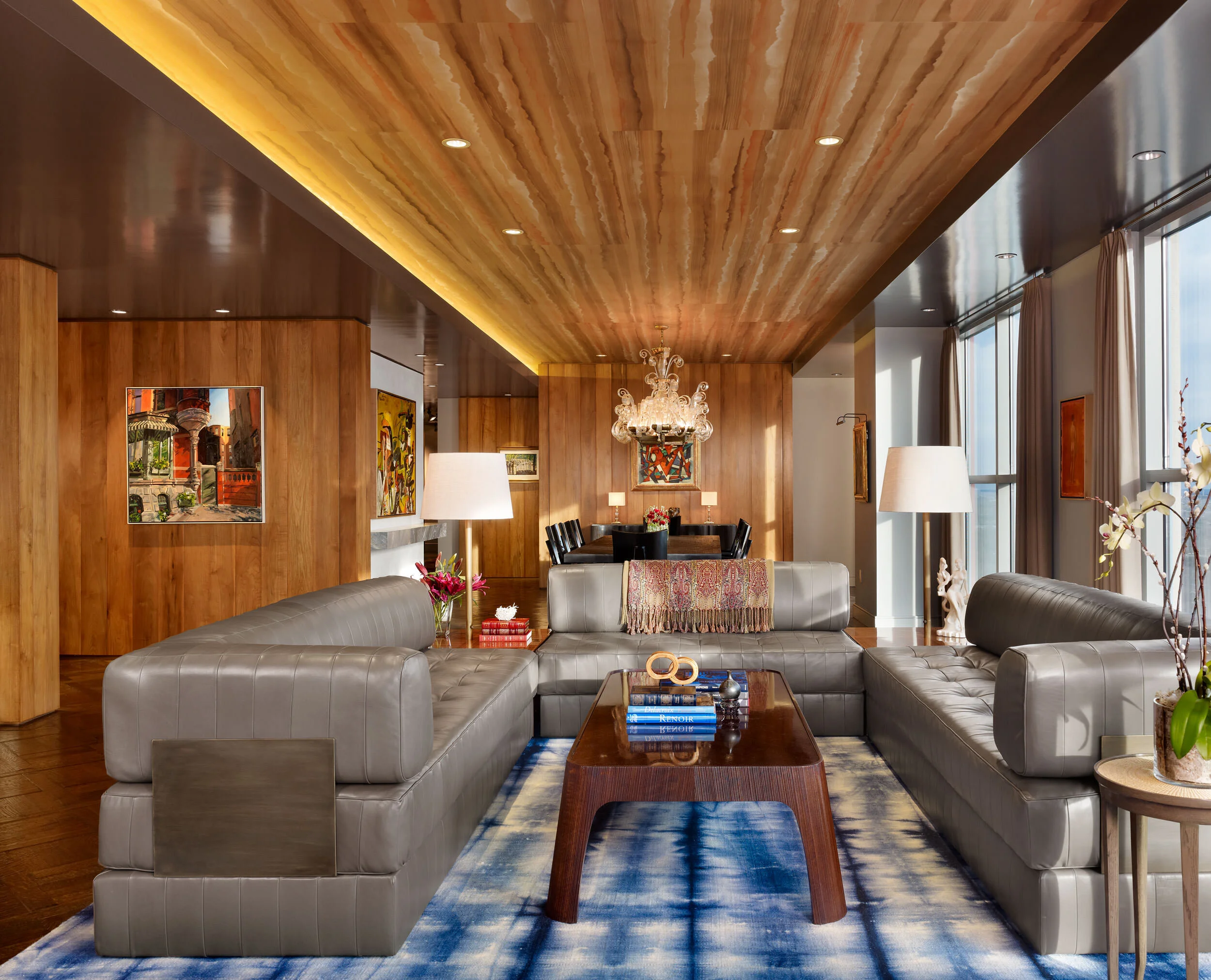  Living room with custom coffee table and sectional beneath hand-painted silk ceiling at the Four Seasons Penthouse by Cravotta Interiors. 