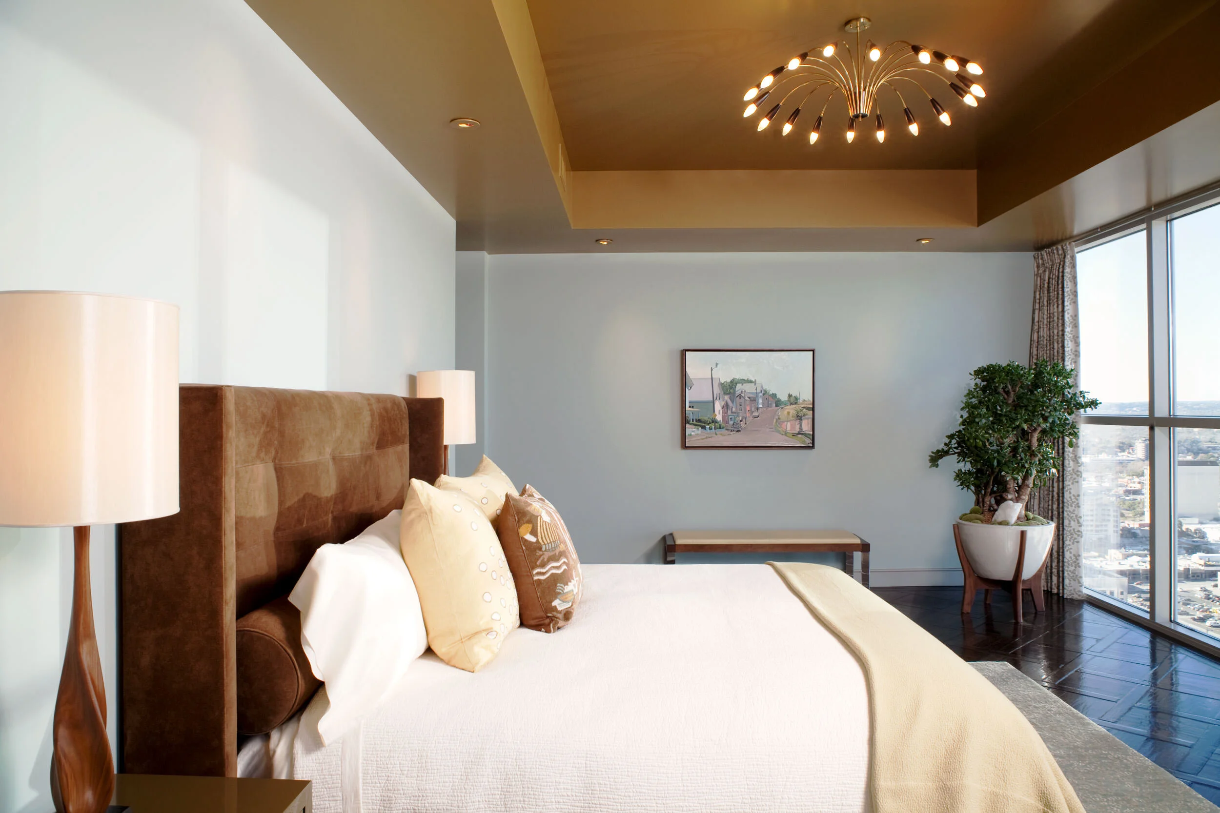  Winter bedroom with suede leather bed and hand-painted drapes in the Four Seasons Penthouse by Cravotta Interiors. 