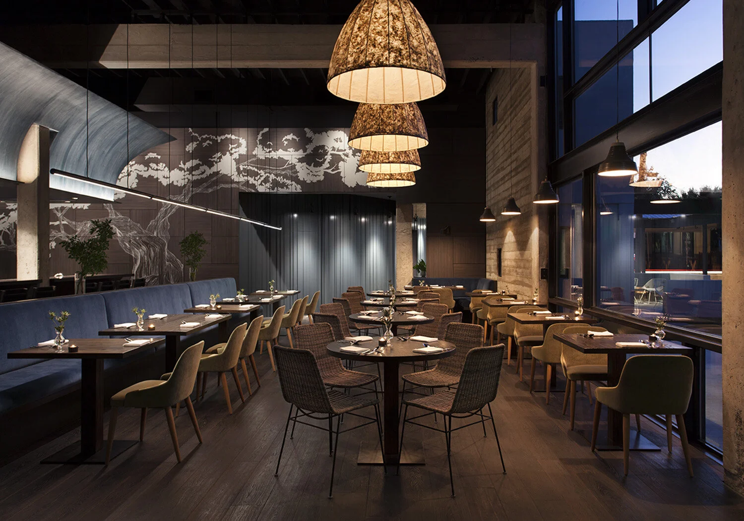  Main dining room with asymmetric painted paneling and board-form concrete walls at Juniper, designed by Mark Cravotta. 