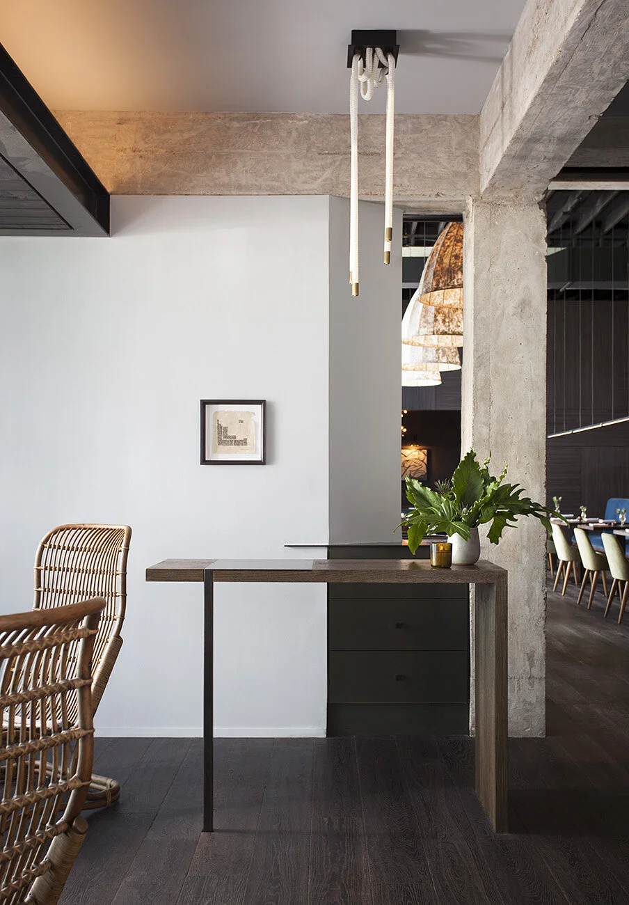  Host stand with asymmetric painted paneling at Juniper Restaurant, Austin, designed by Mark Cravotta. 