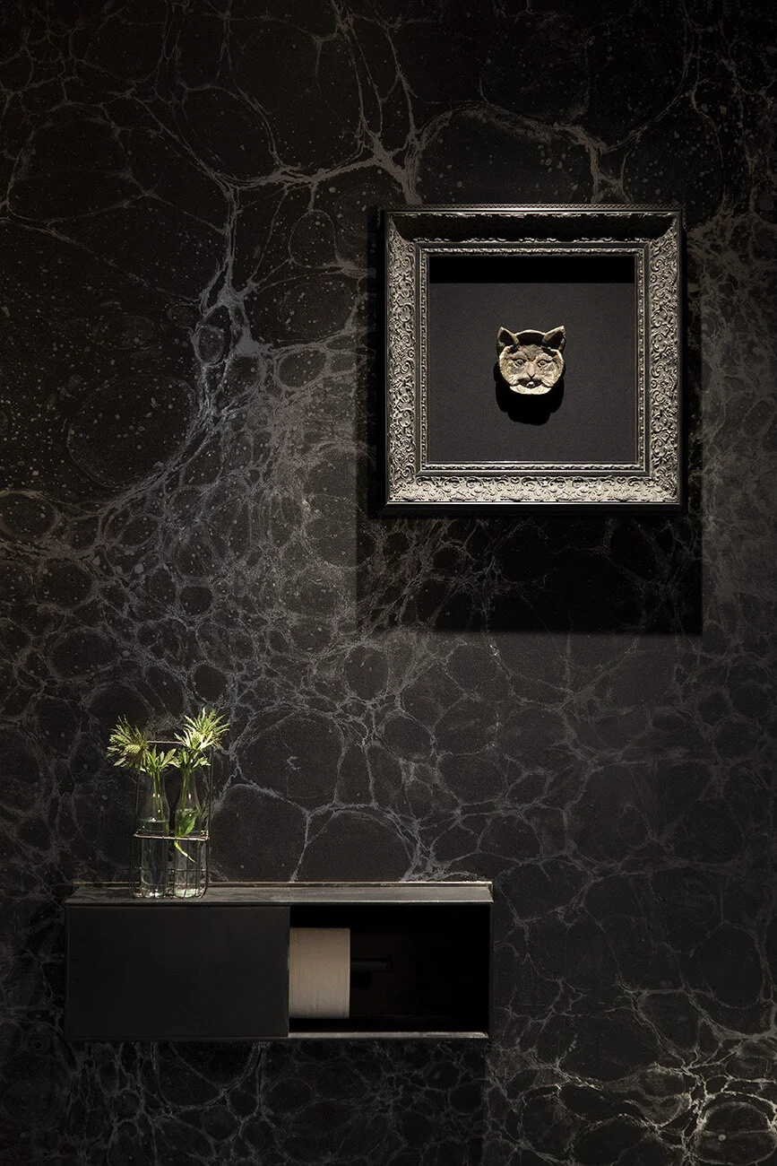  Cosmic-themed restroom with dramatic wallpaper at Juniper Restaurant, designed by Mark Cravotta. 