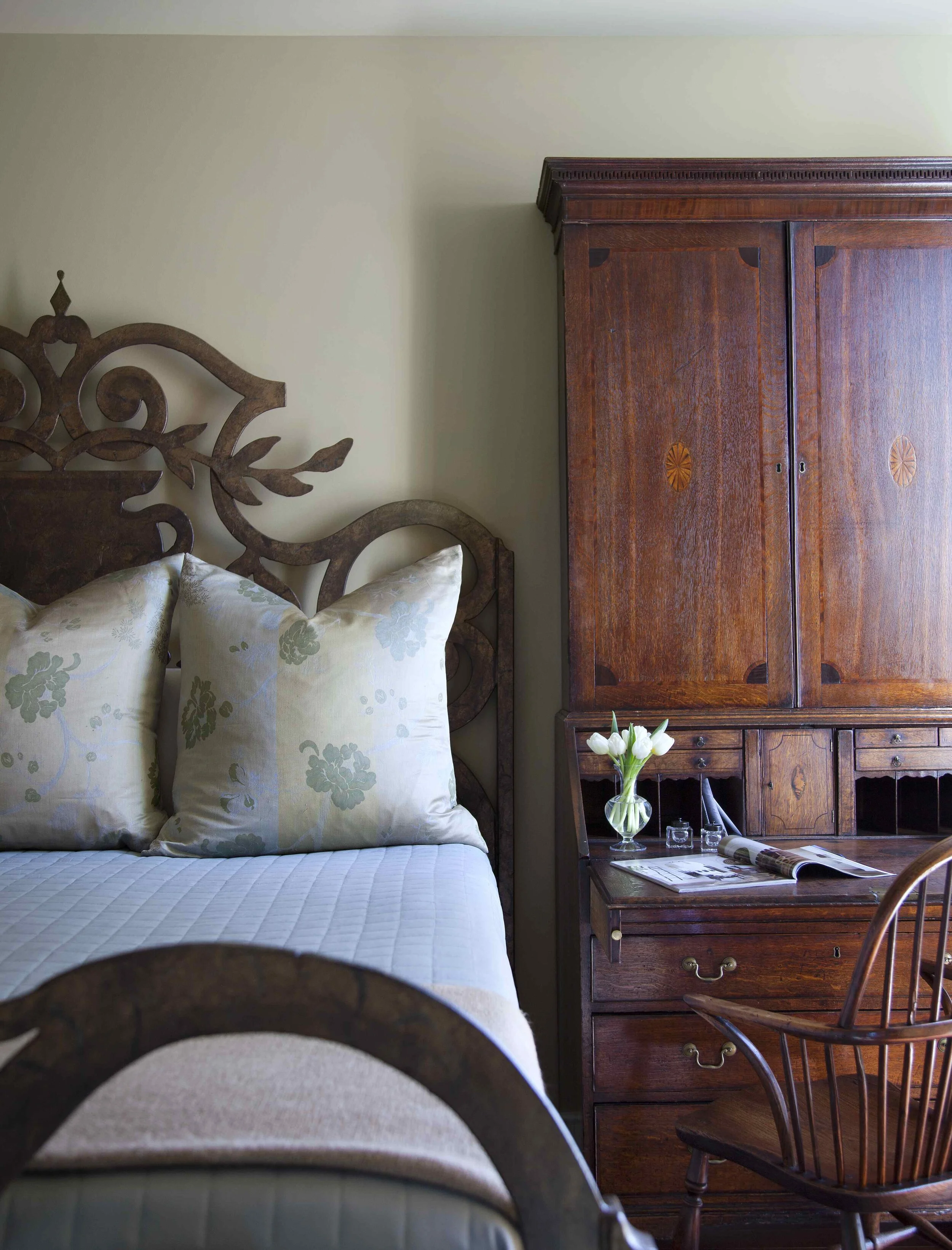  Guest bedroom with steel bed and antique secretary desk at Northumberland, designed by Mark Cravotta. 