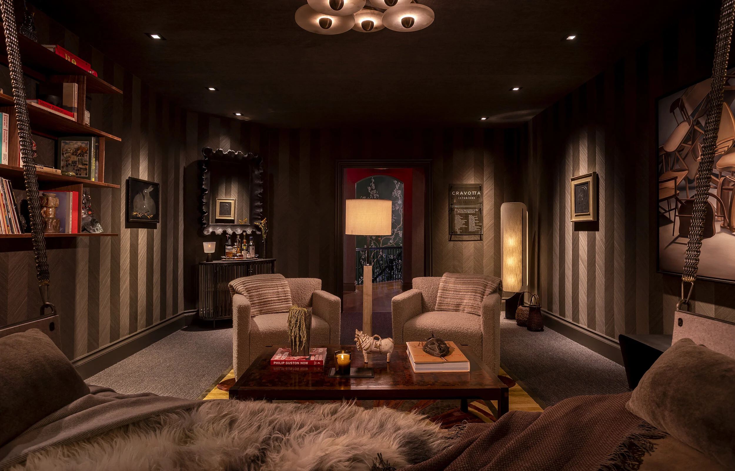  Rear view showing glass bar and antique furnishings in the Kips Bay listening room, designed by Mark Cravotta. 