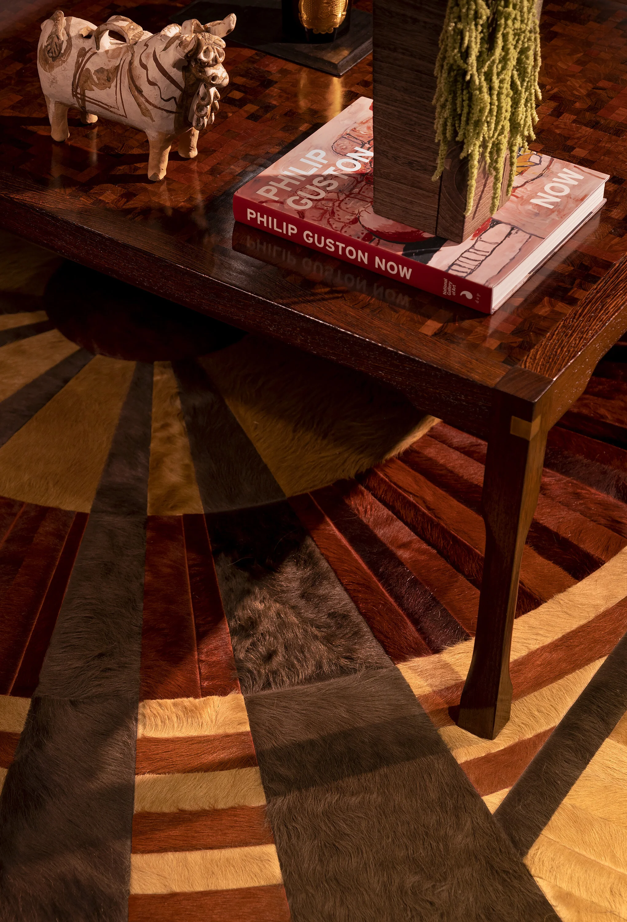  Custom mosaic cowhide rug on the floor of the Kips Bay hi-fi room, designed by Mark Cravotta. 