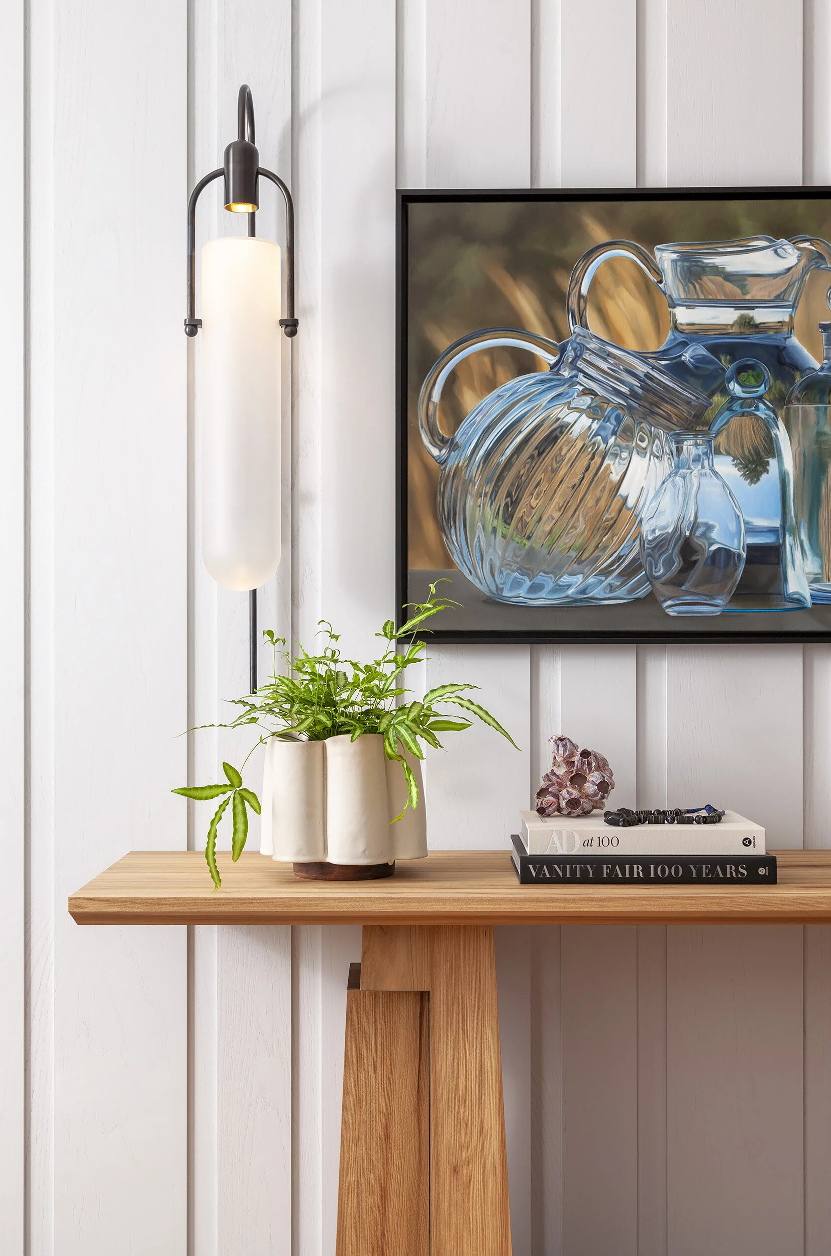 Bruno Moinard console against painted wood paneling in the Proper Penthouse entry by Cravotta Interiors. 