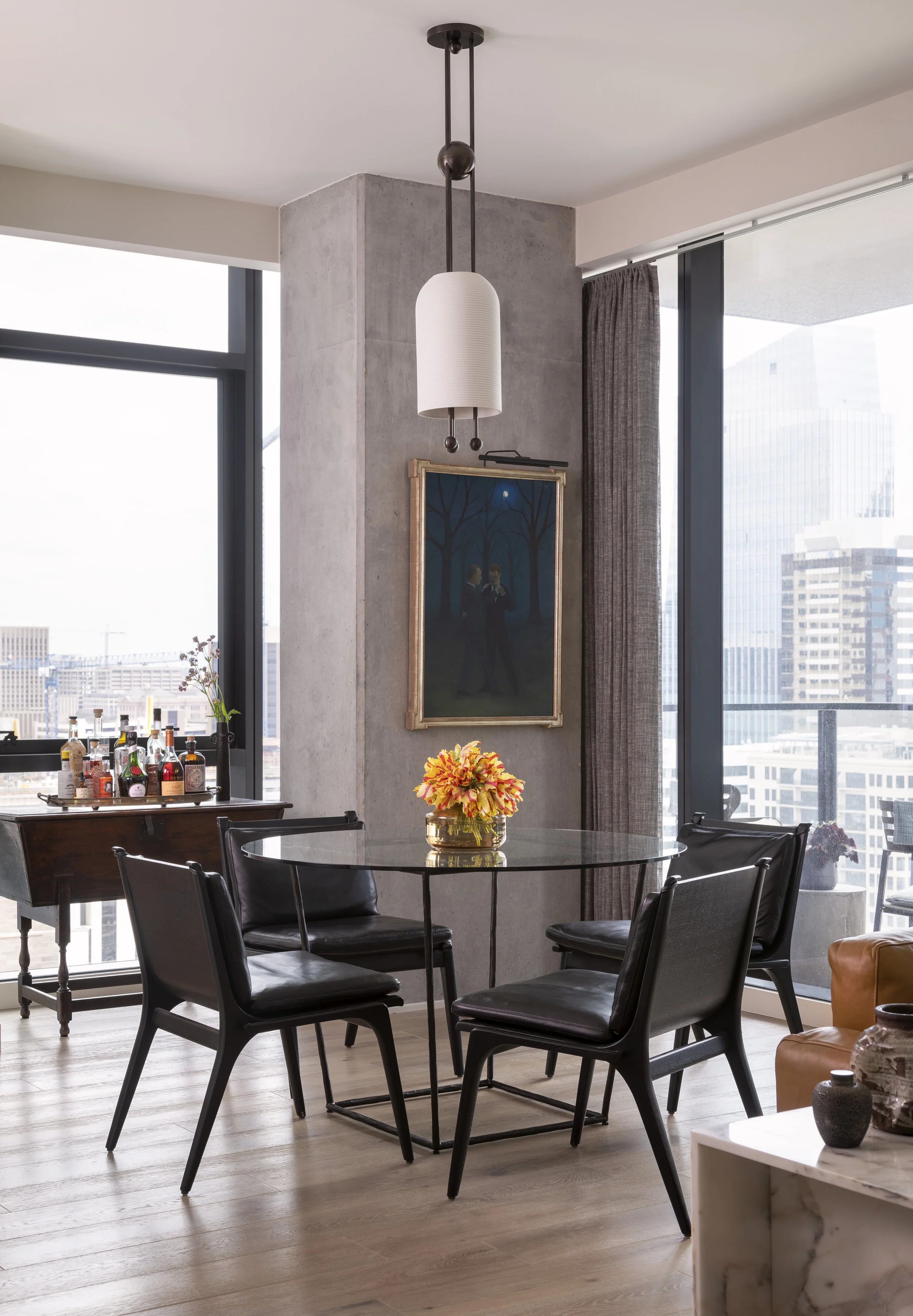  Dining area with eclectic furnishings and vibrant palette at the Proper Residence by Cravotta Interiors. 