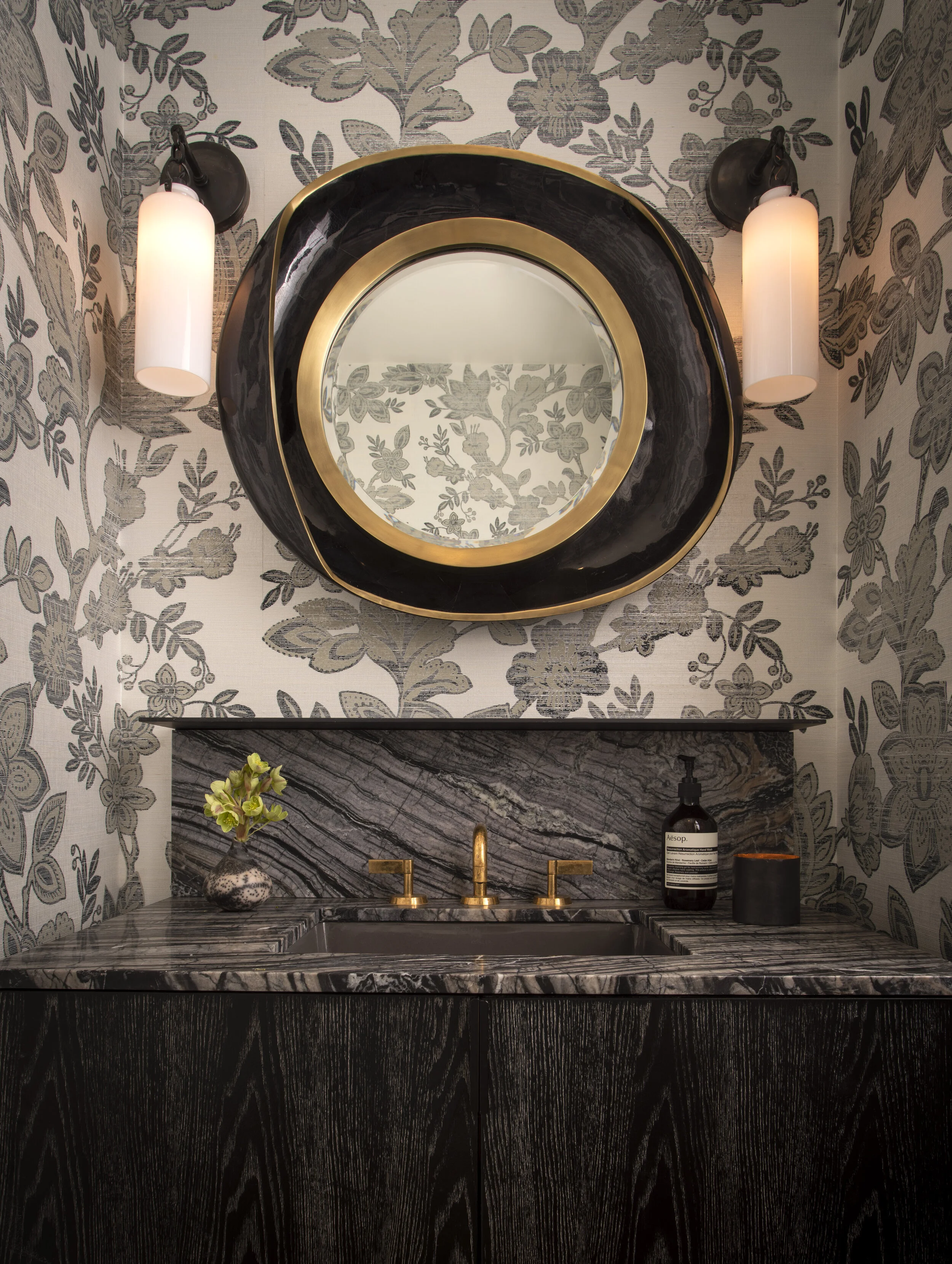  Powder room with dramatic wallpaper at the Austin Proper Residence by Cravotta Interiors. 
