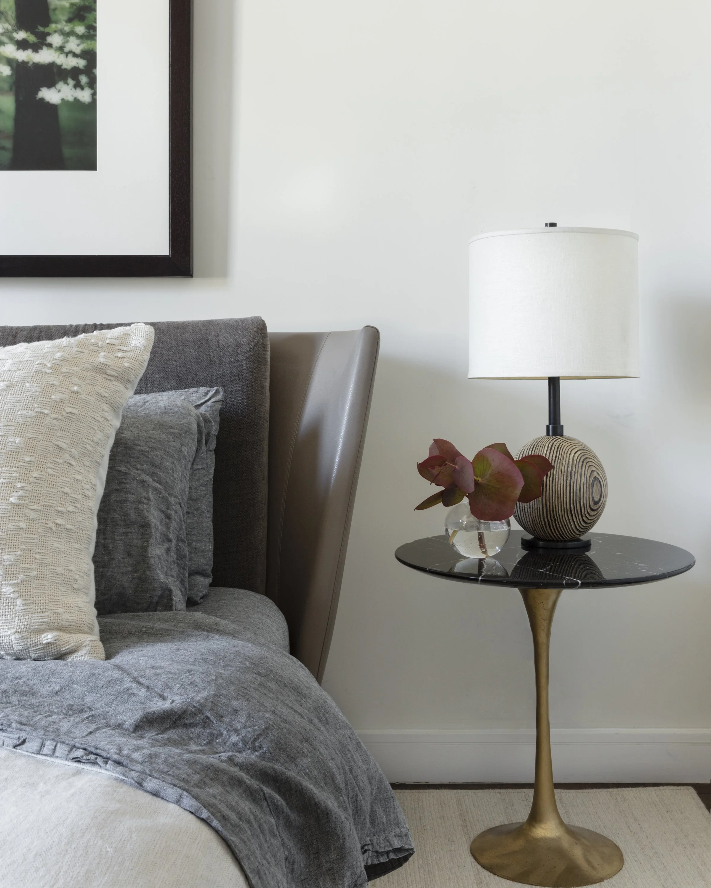  Bedside detail with art and accessories at Stella NYC, designed by Mark Cravotta. 