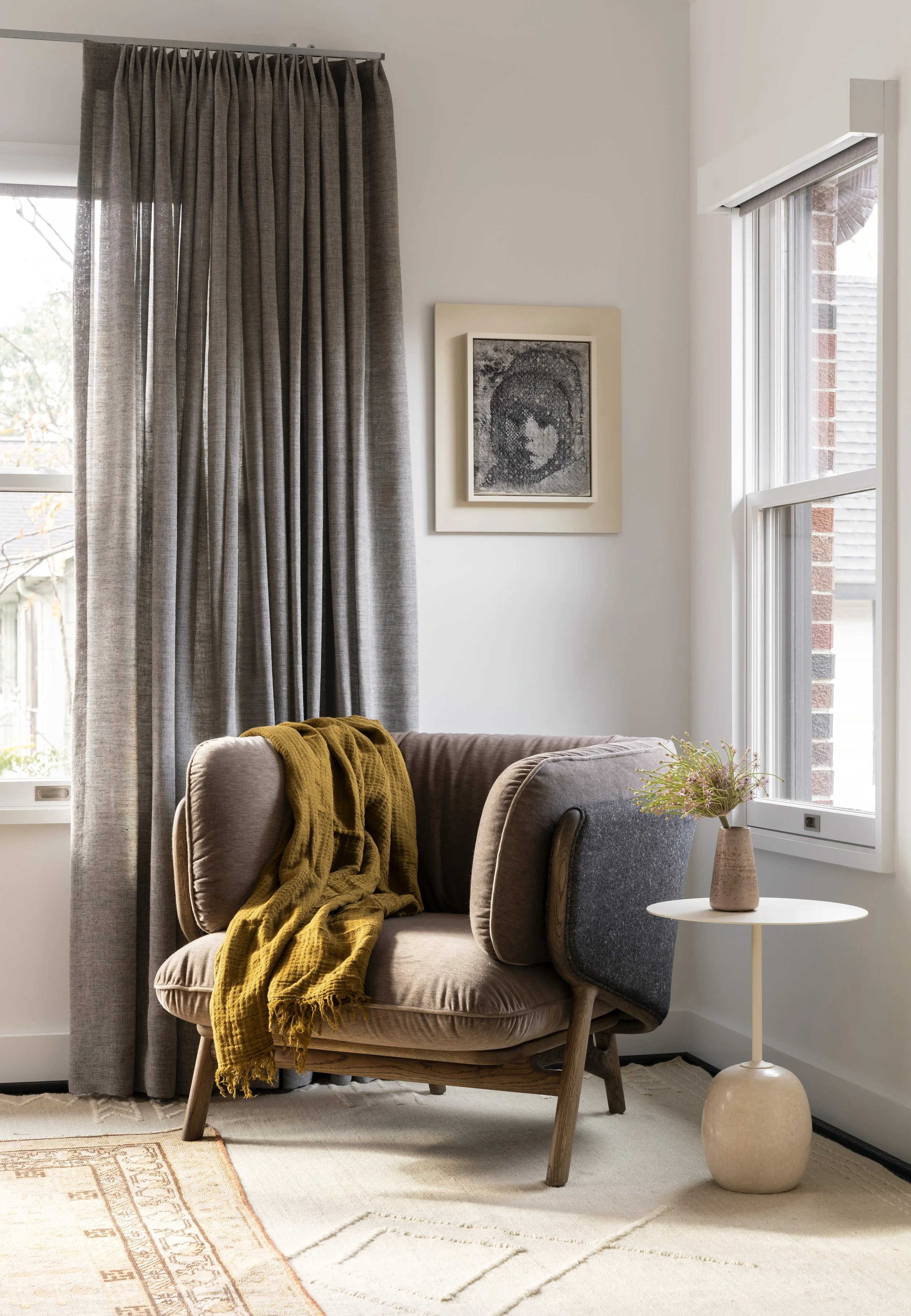  Reading chair vignette in the Boulevard Oaks primary bedroom by Cravotta Interiors. 