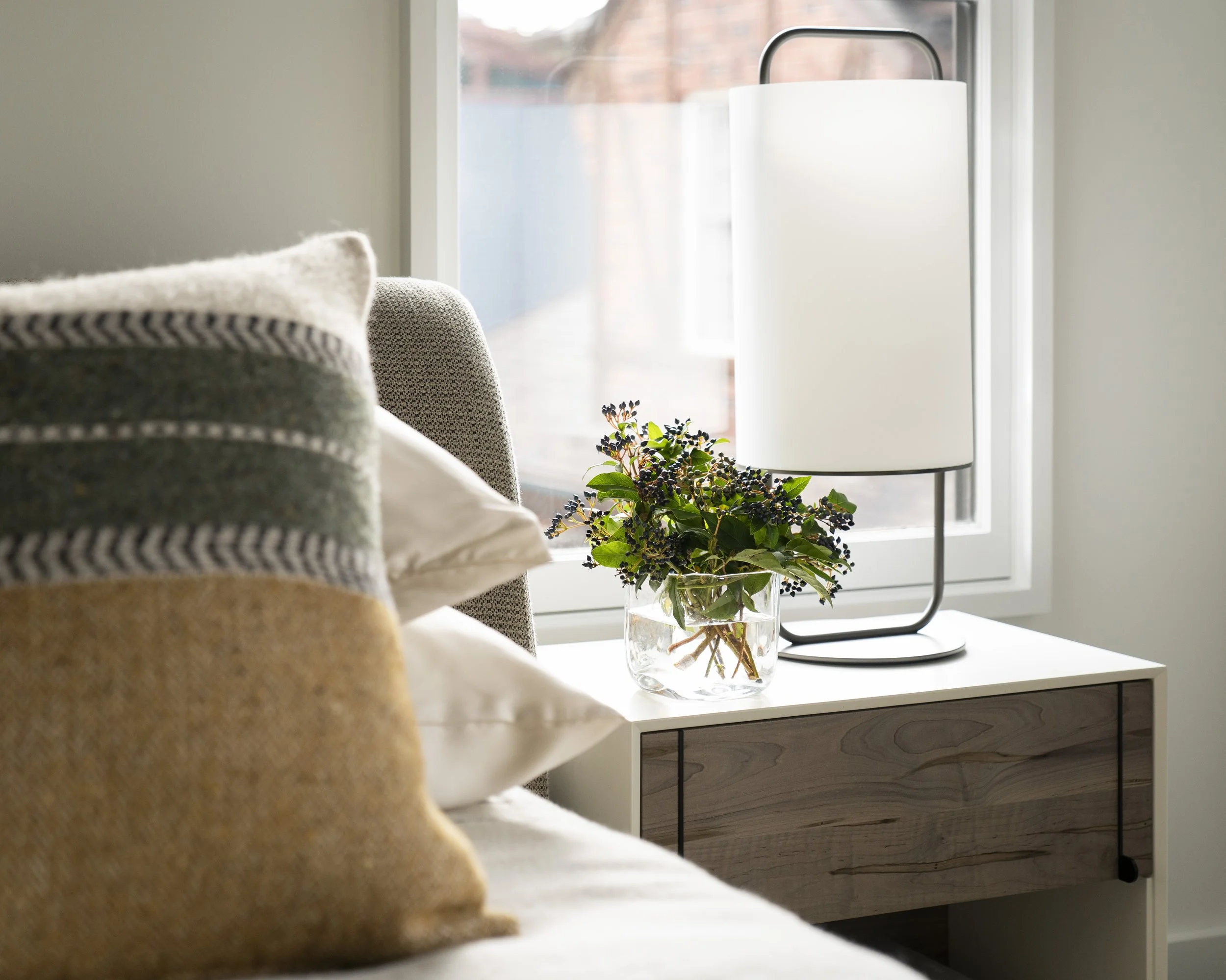  Bedside table detail in the Boulevard Oaks primary bedroom, designed by Mark Cravotta. 