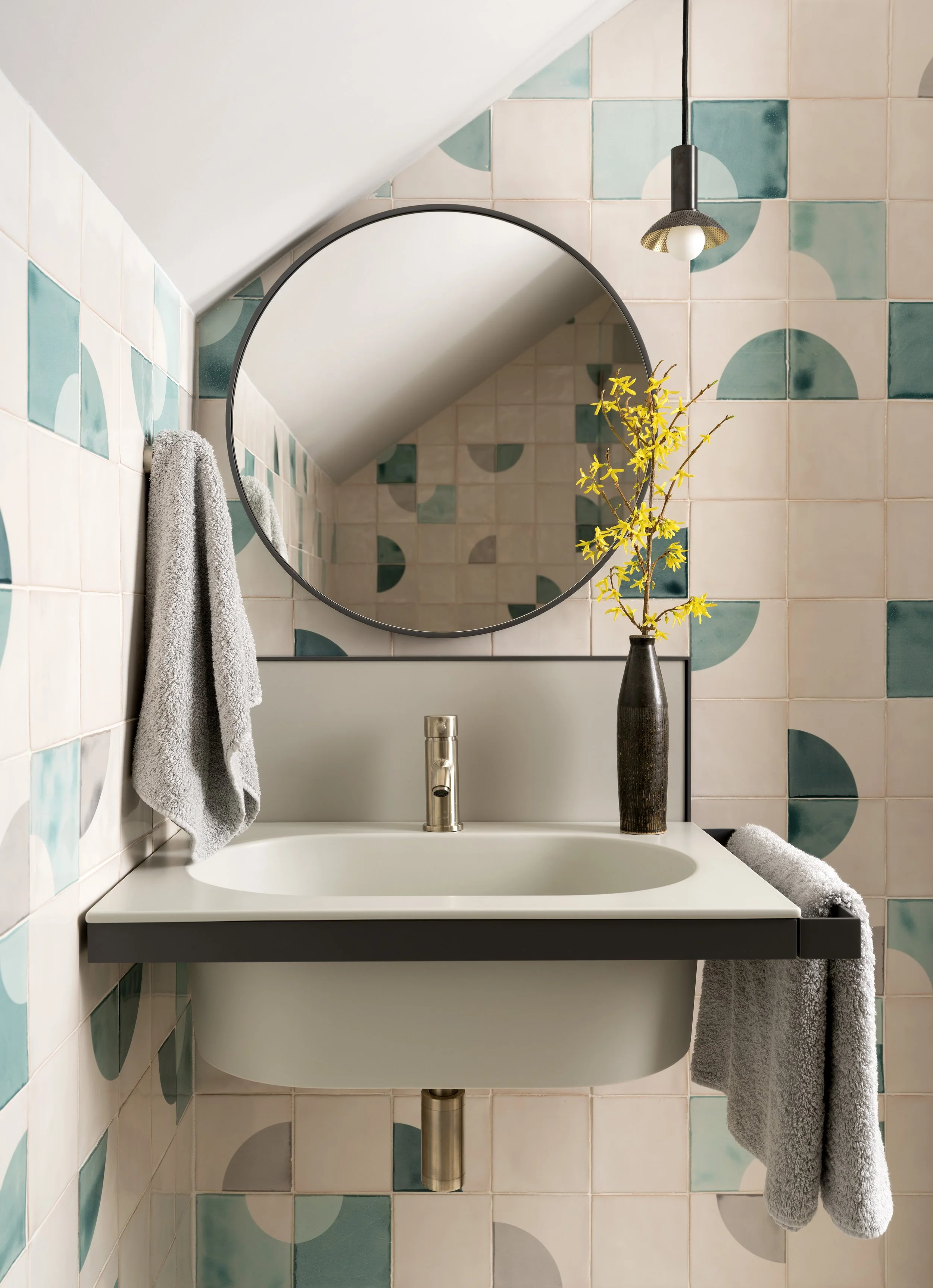  Art-filled powder room with handmade tile and Allied Maker lighting in the Boulevard Oaks home, designed by Mark Cravotta. 