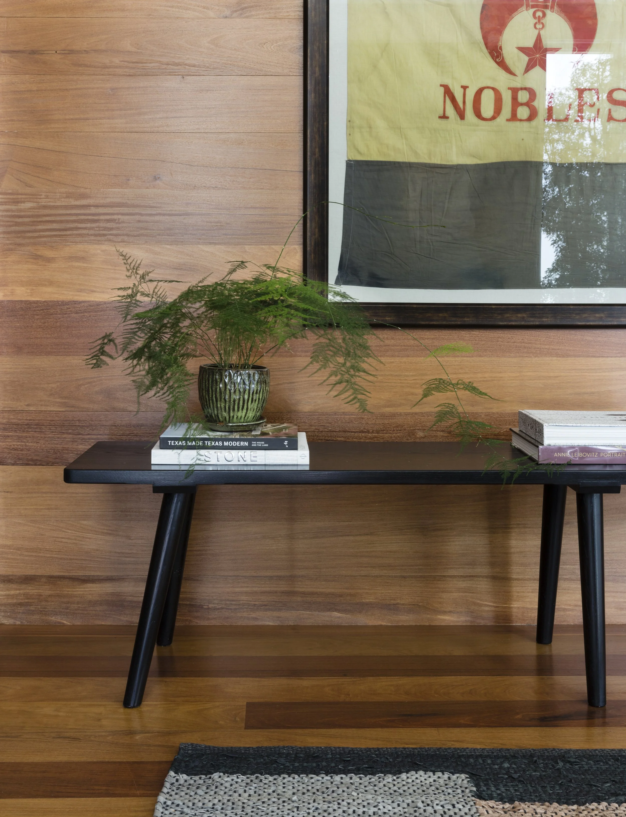  Entry bench detail against walnut wall paneling at the Rabb Road home by Cravotta Interiors. 