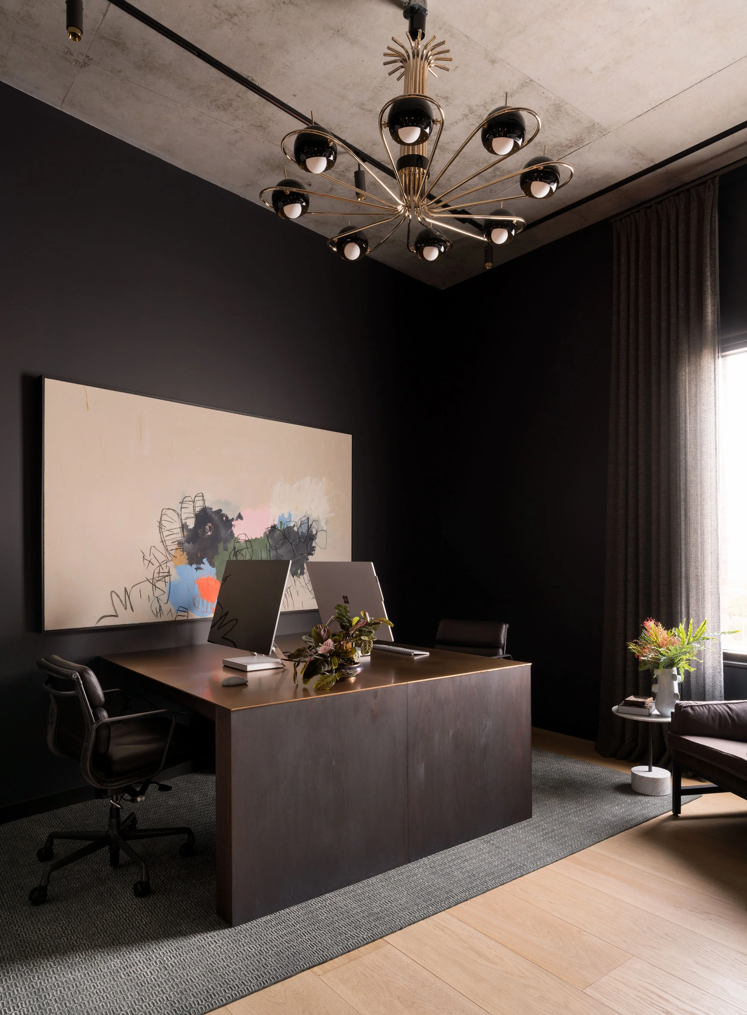  Industrial home office with custom walnut and bronze partner's desk in the St. Cecilia condo, designed by Mark Cravotta. 