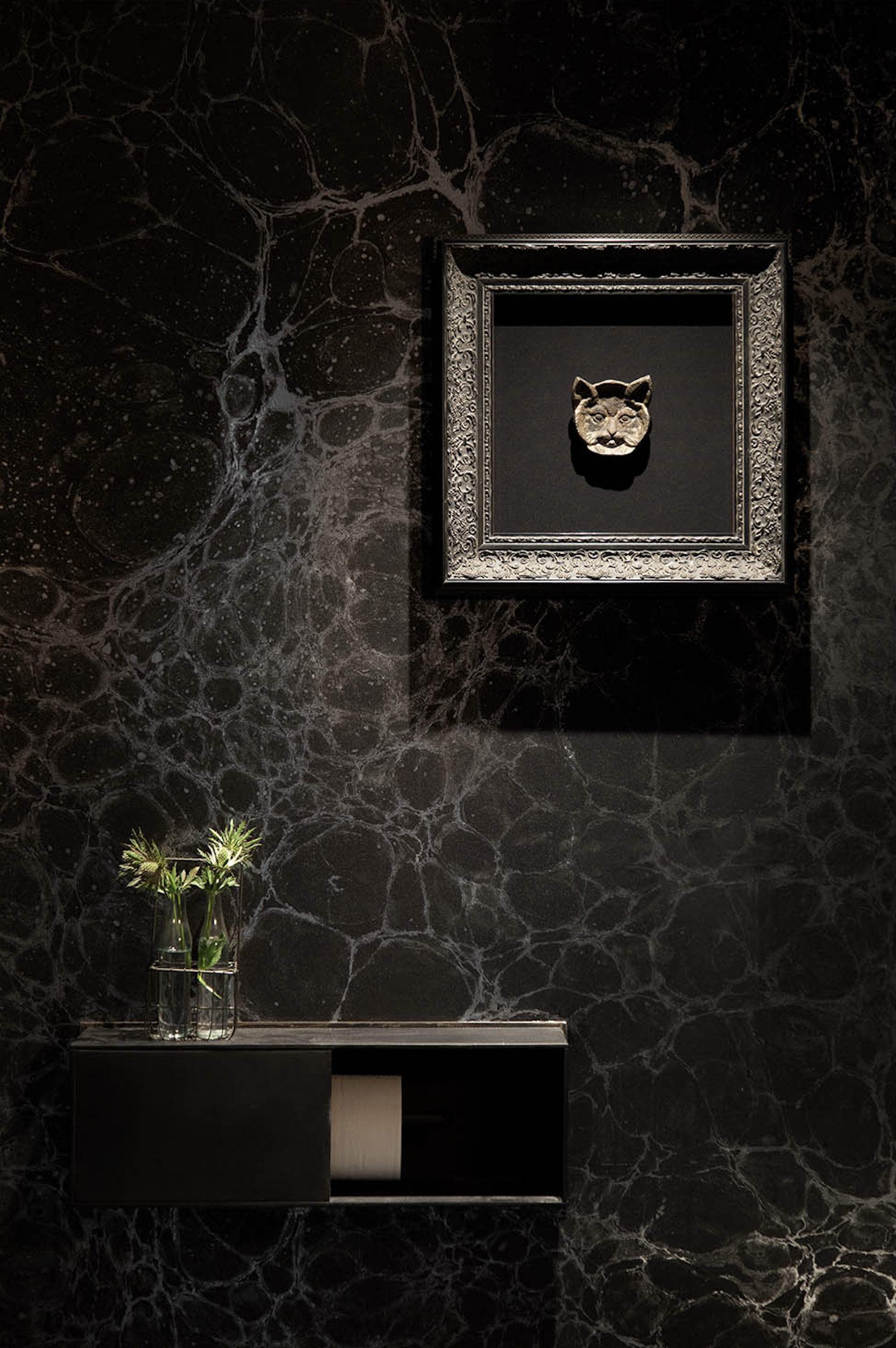 Juniper restaurant restroom with handpainted celestial wallpaper and iron cat sculpture, designed by Cravotta Interiors